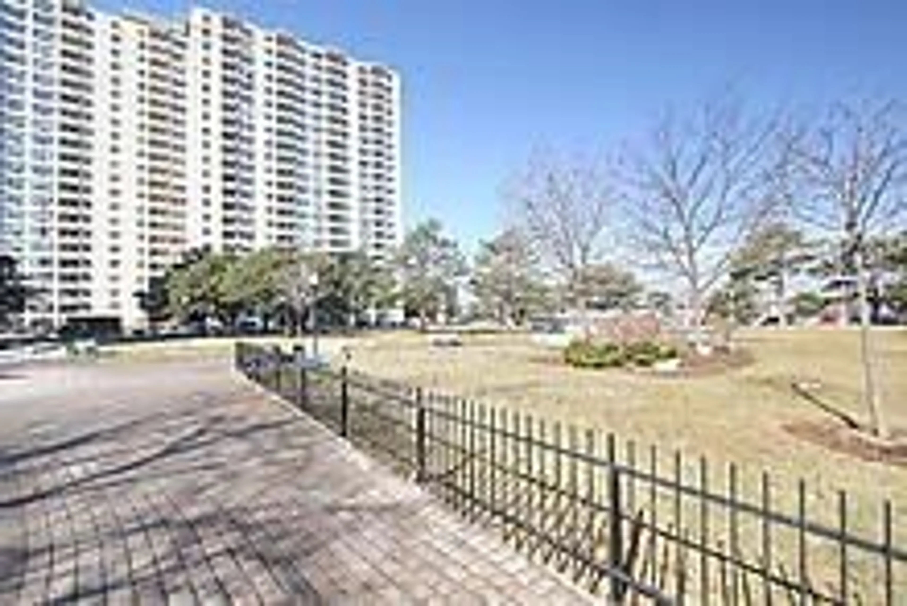 A pic from exterior of the house or condo, the fenced backyard for 370 Dixon Rd #408, Toronto Ontario M9R 1T2