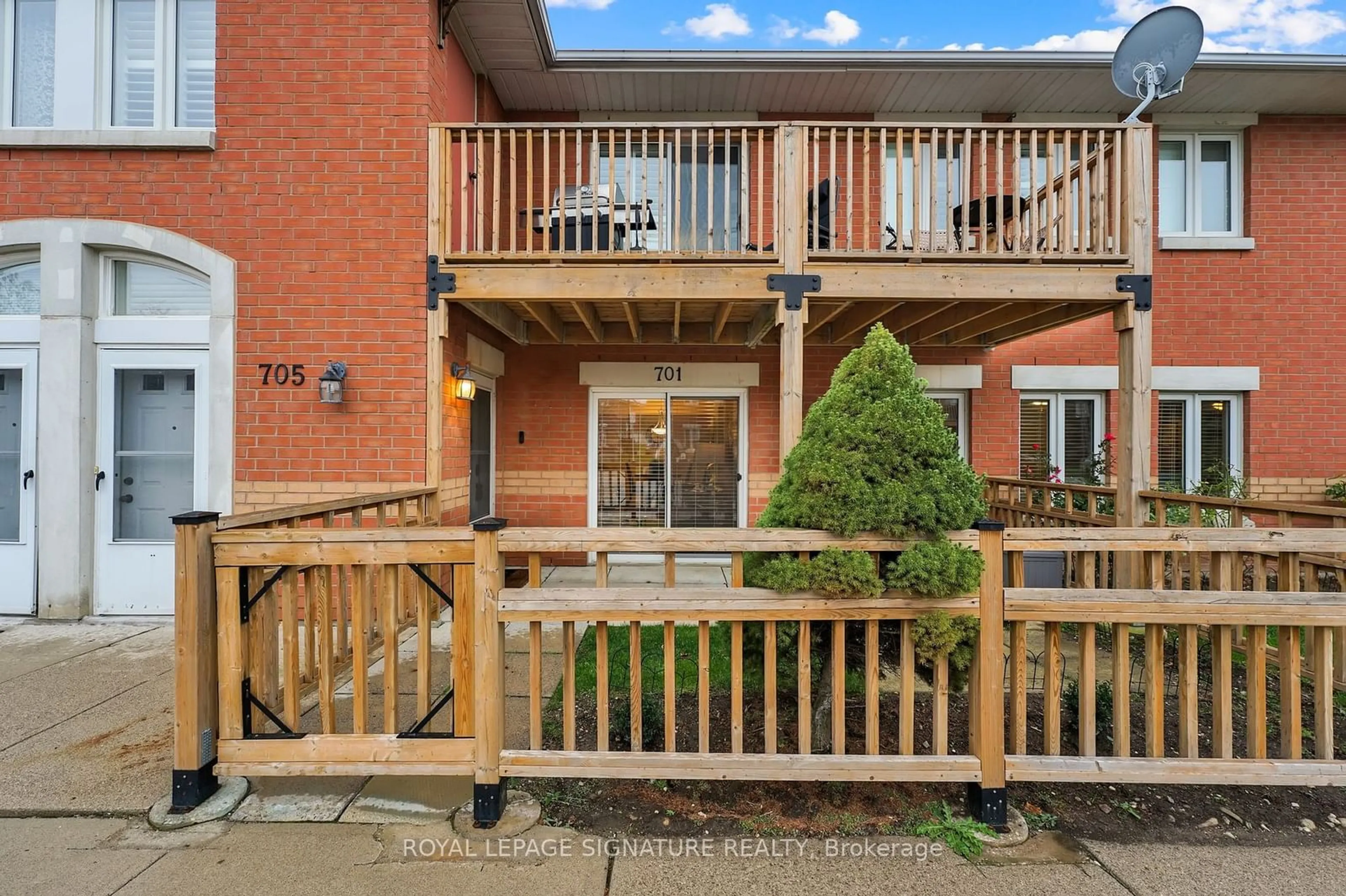 A pic from exterior of the house or condo, the fenced backyard for 4140 Foxwood Dr #701, Burlington Ontario L7M 4R4