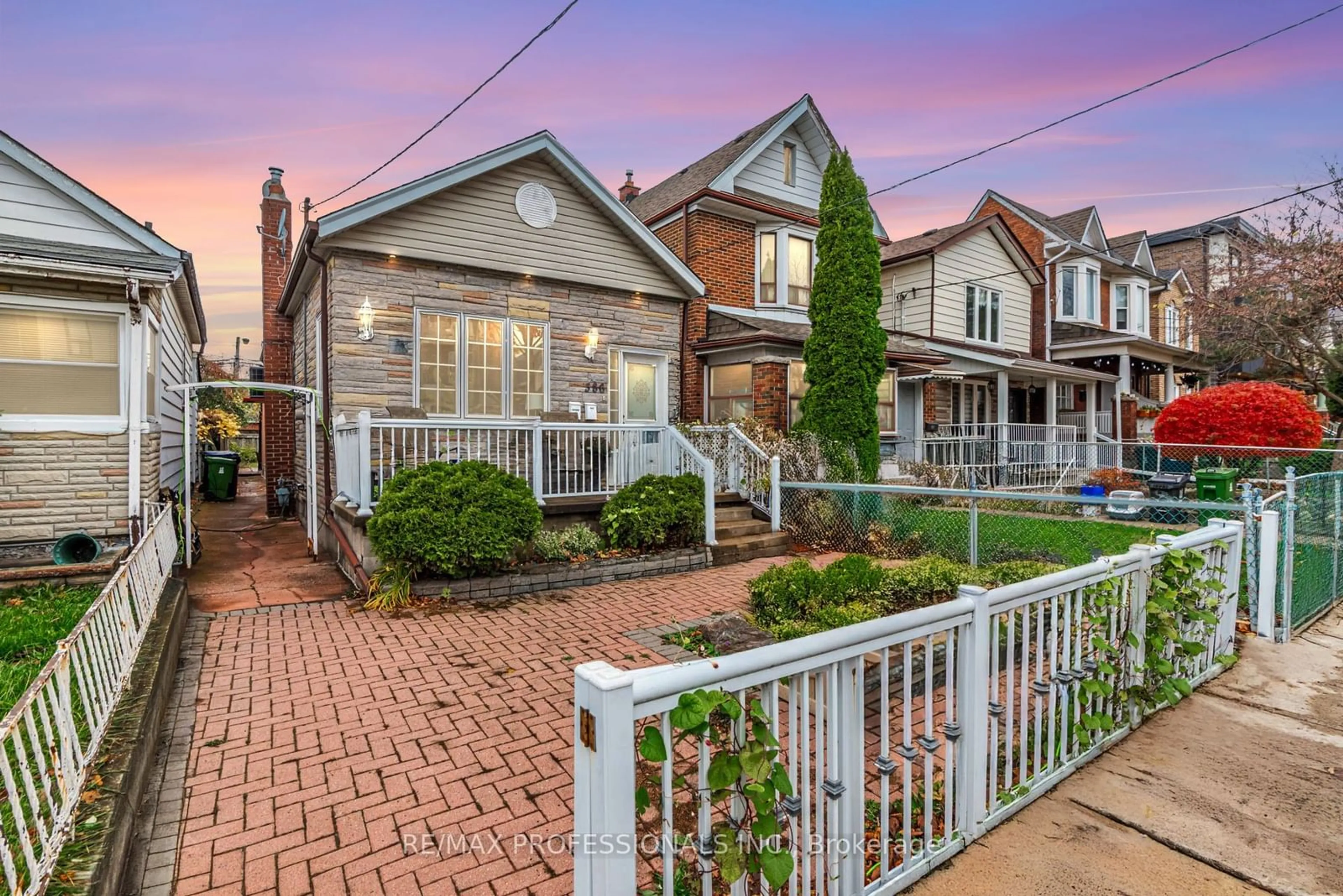 Frontside or backside of a home, the fenced backyard for 386 Westmoreland Ave, Toronto Ontario M6H 3A7