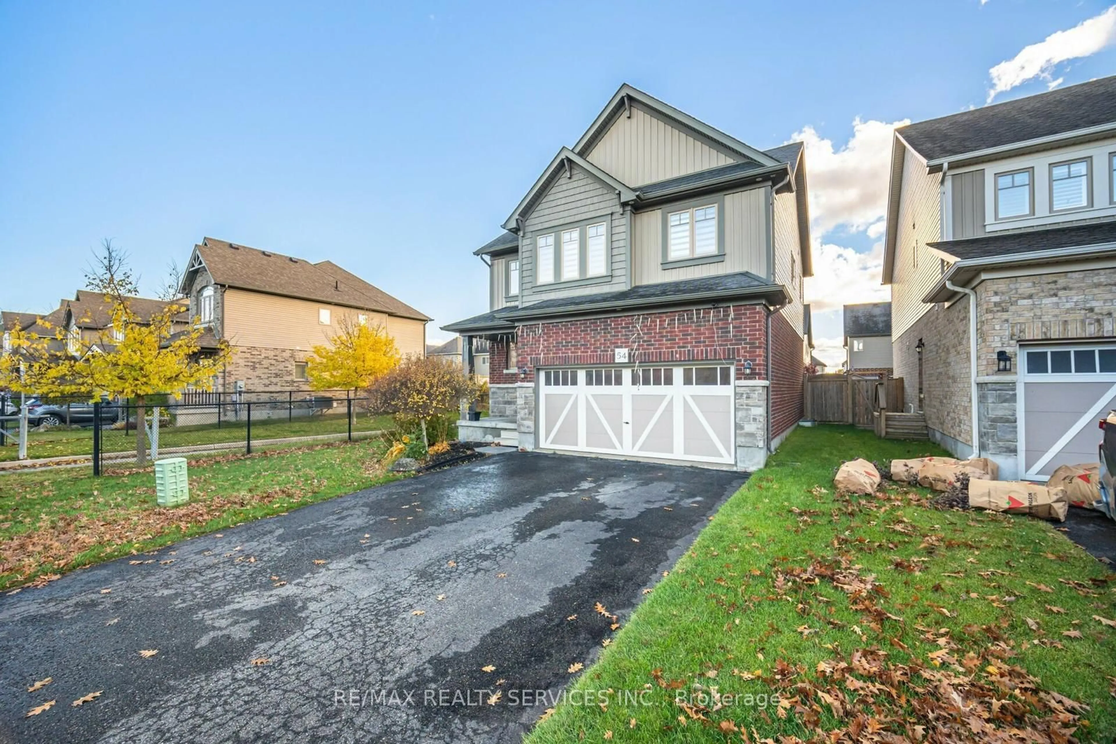 Frontside or backside of a home, the fenced backyard for 54 Wardlaw Ave, Orangeville Ontario L9W 6M3