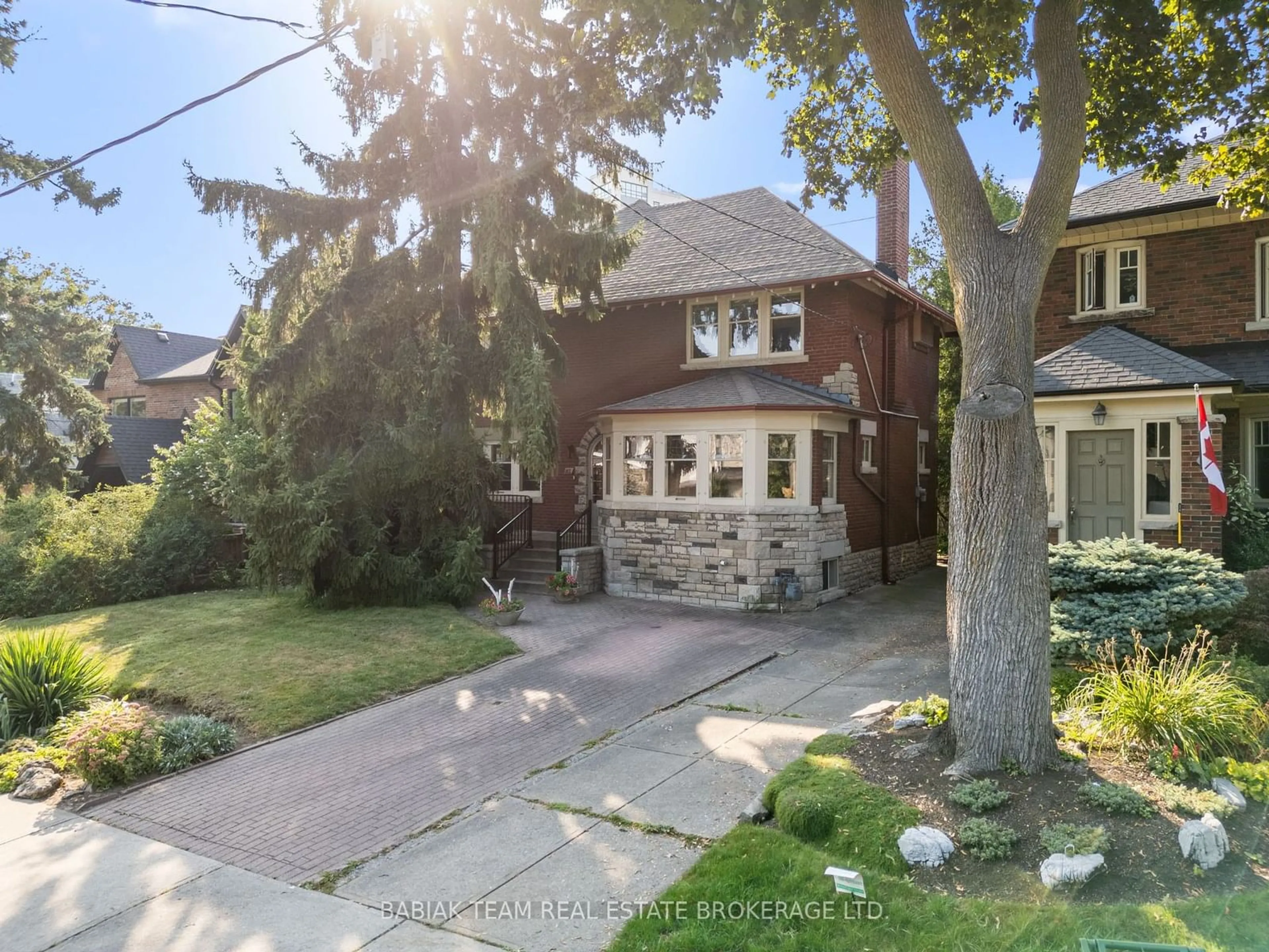 Frontside or backside of a home, the street view for 42 Larkin Ave, Toronto Ontario M6S 1L8