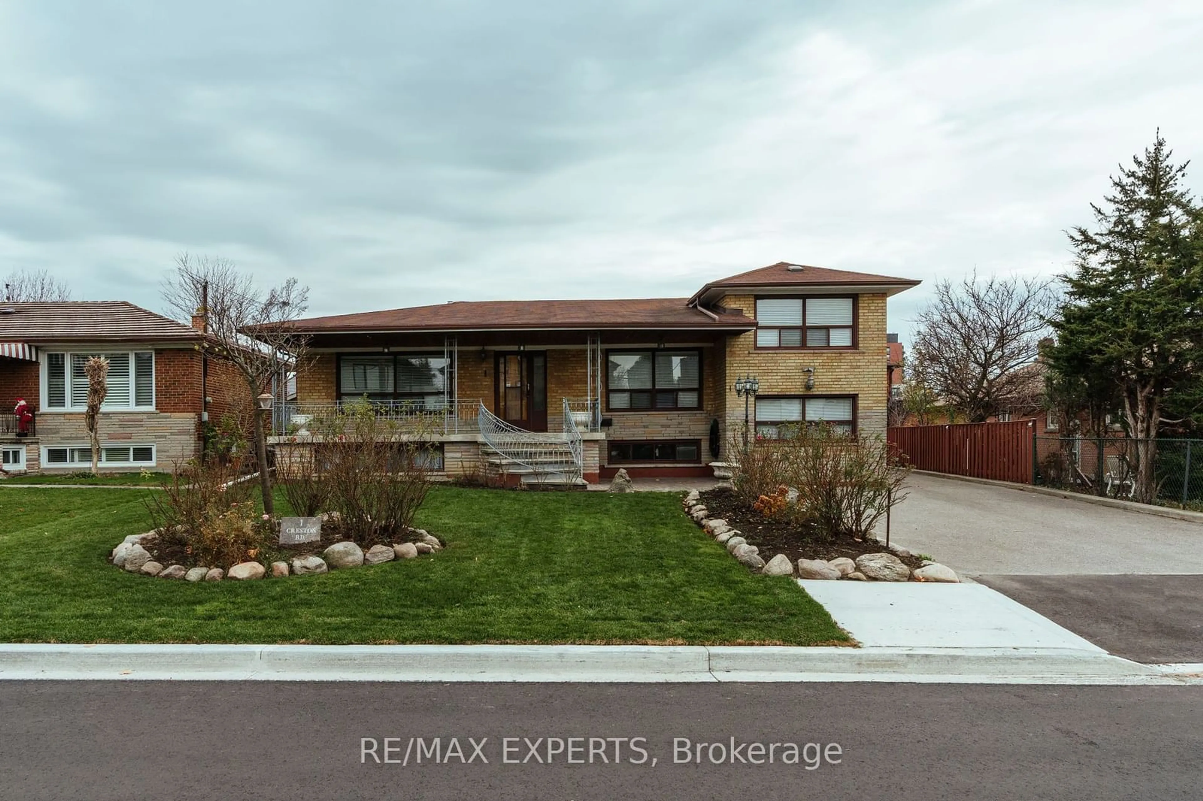 Frontside or backside of a home, the street view for 1 Creston Rd, Toronto Ontario M6A 1H9