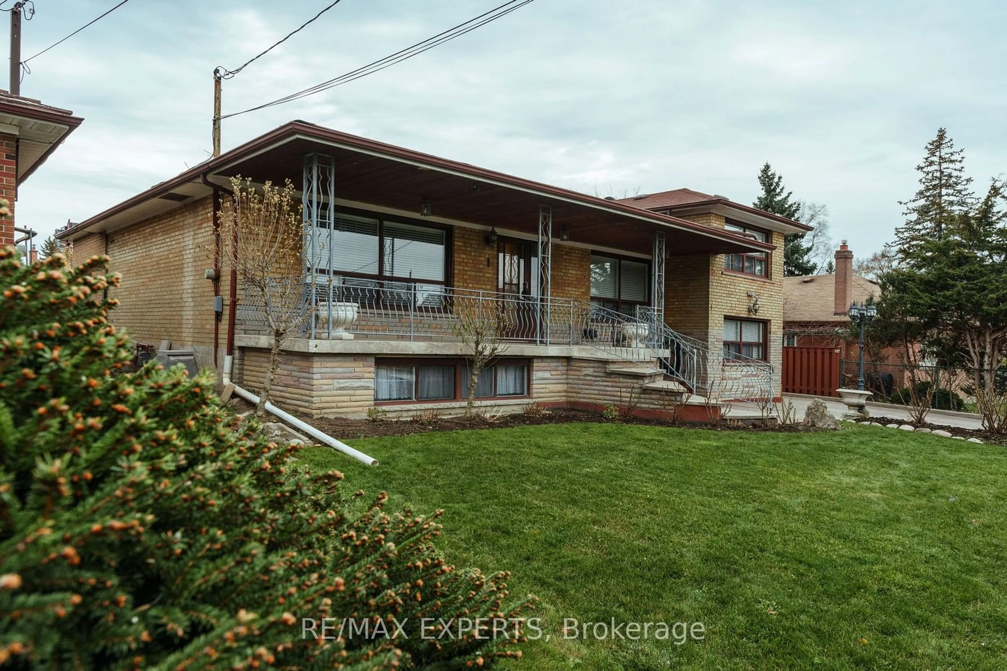 Frontside or backside of a home, the street view for 1 Creston Rd, Toronto Ontario M6A 1H9