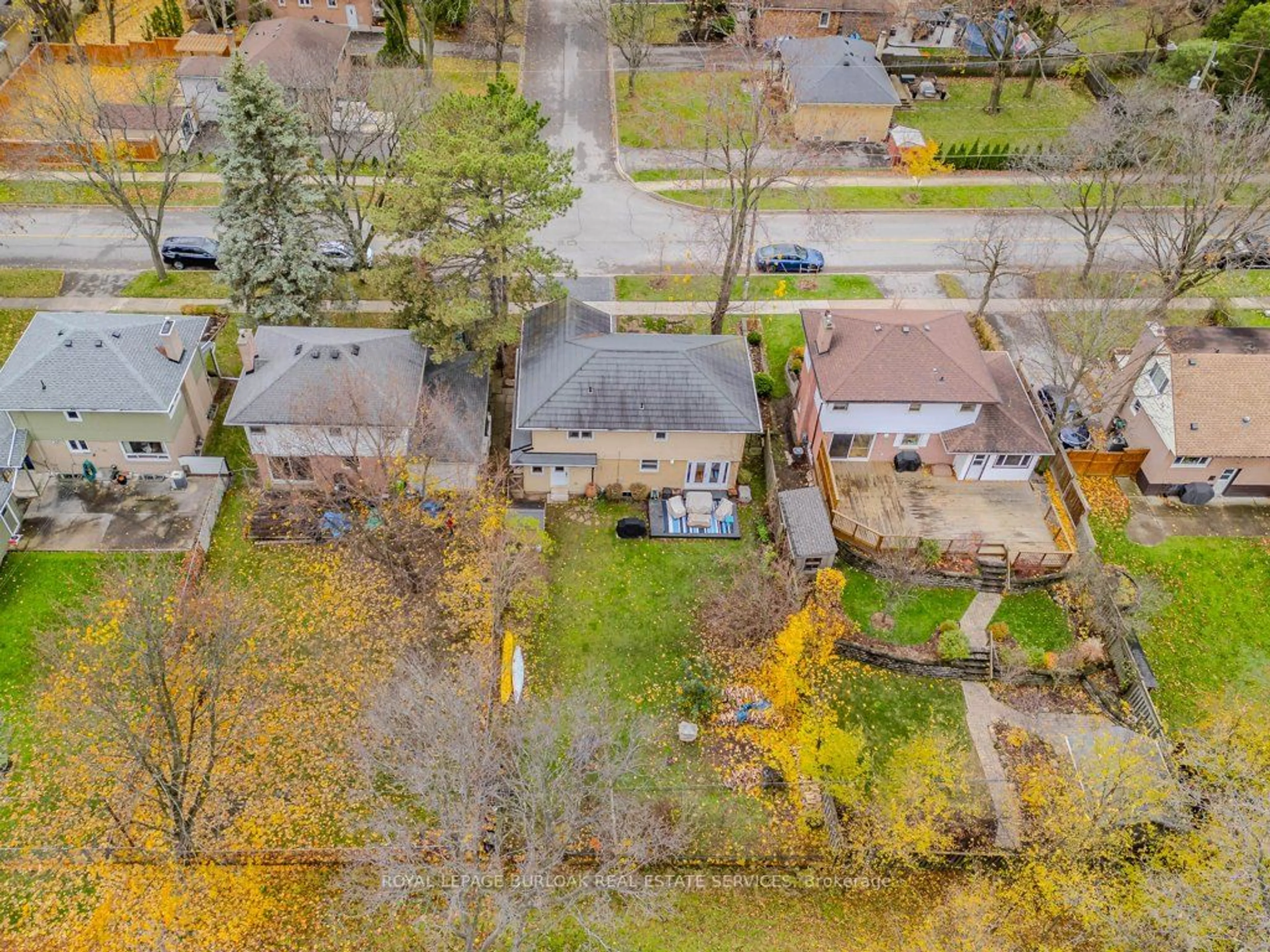 Frontside or backside of a home, the fenced backyard for 1399 Augustine Dr, Burlington Ontario L7P 2M9