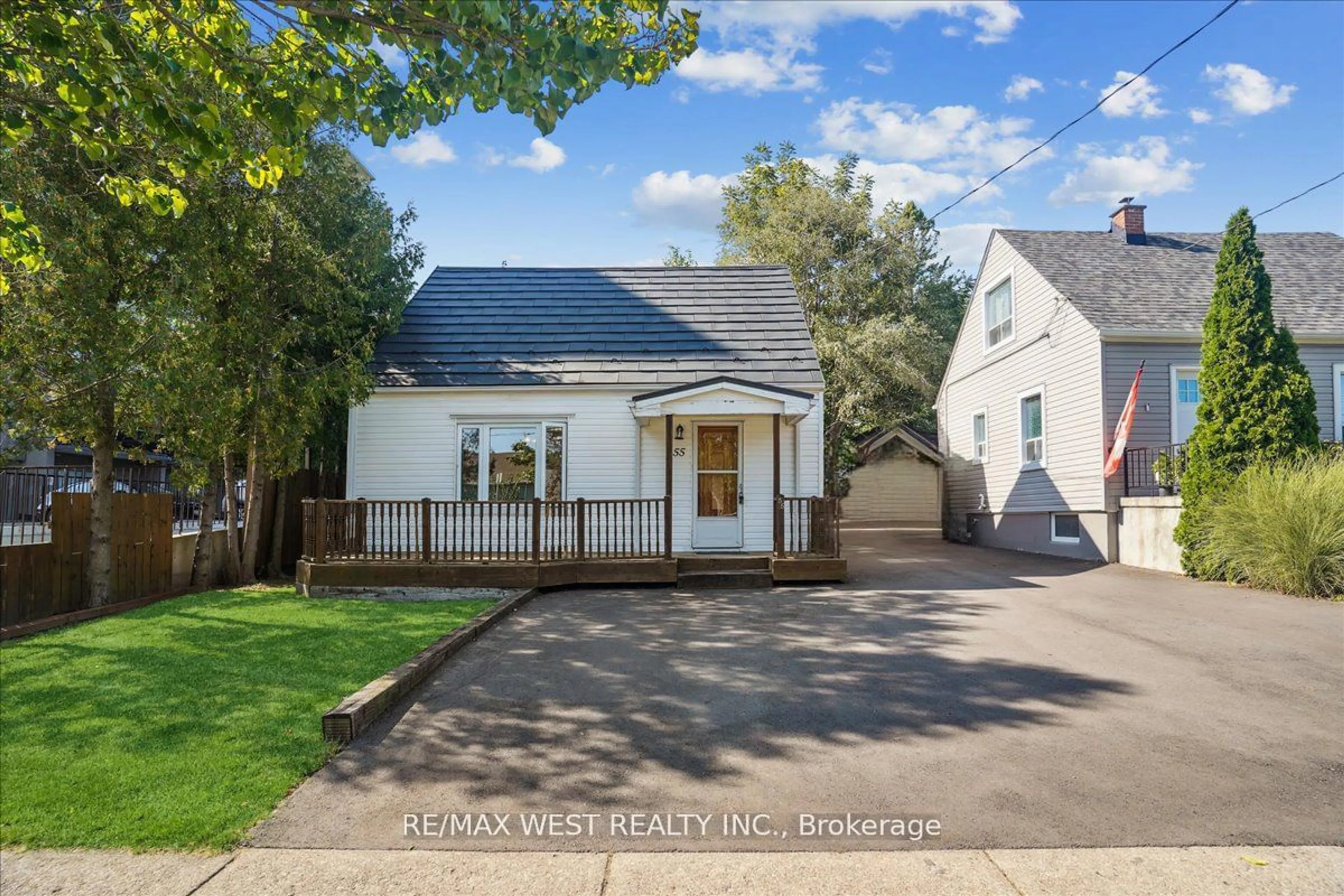 Frontside or backside of a home, the street view for 55 Stewart St, Oakville Ontario L6K 1X6