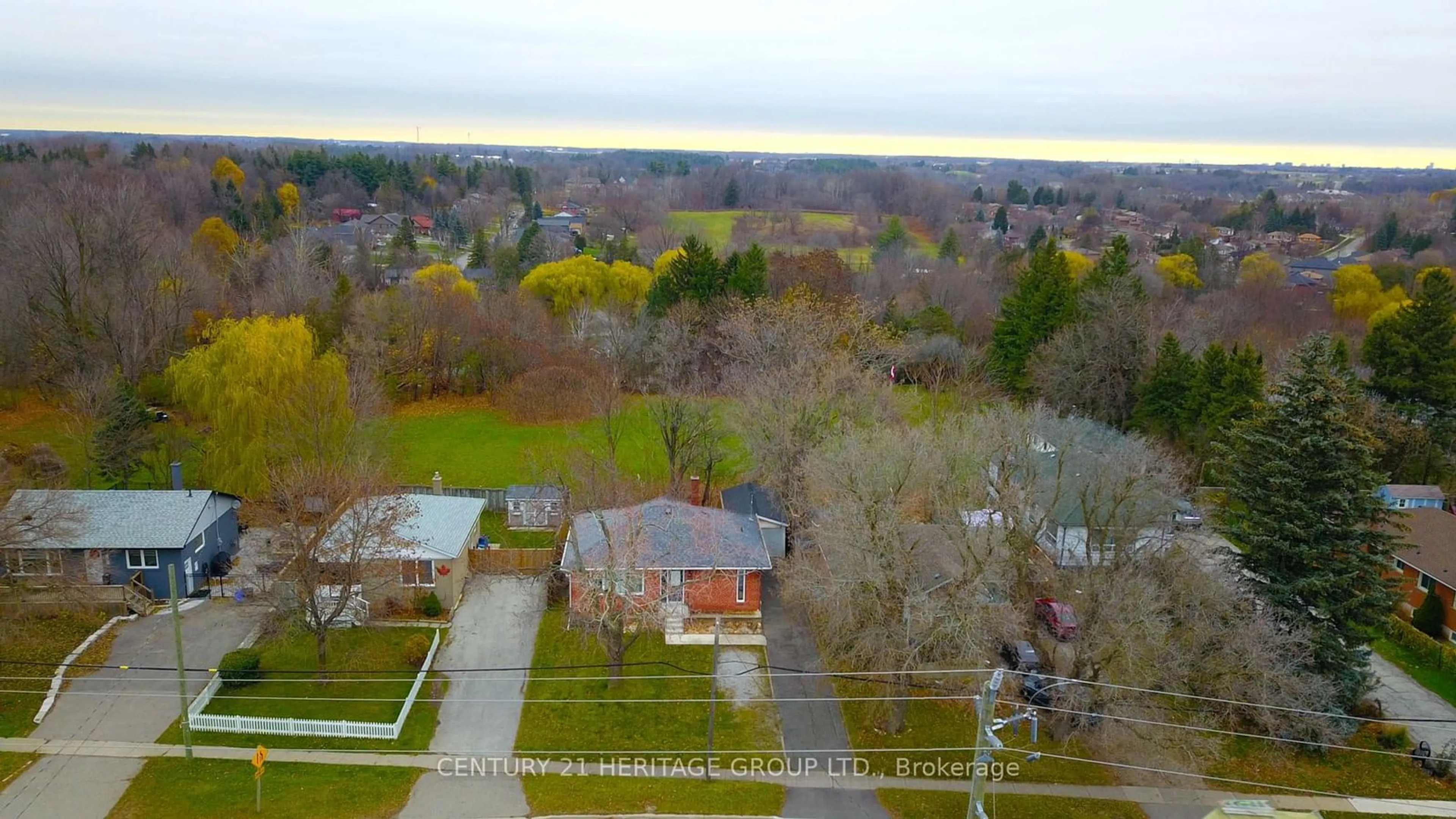 A pic from exterior of the house or condo, the fenced backyard for 103 Main St, Halton Hills Ontario L7G 3H5