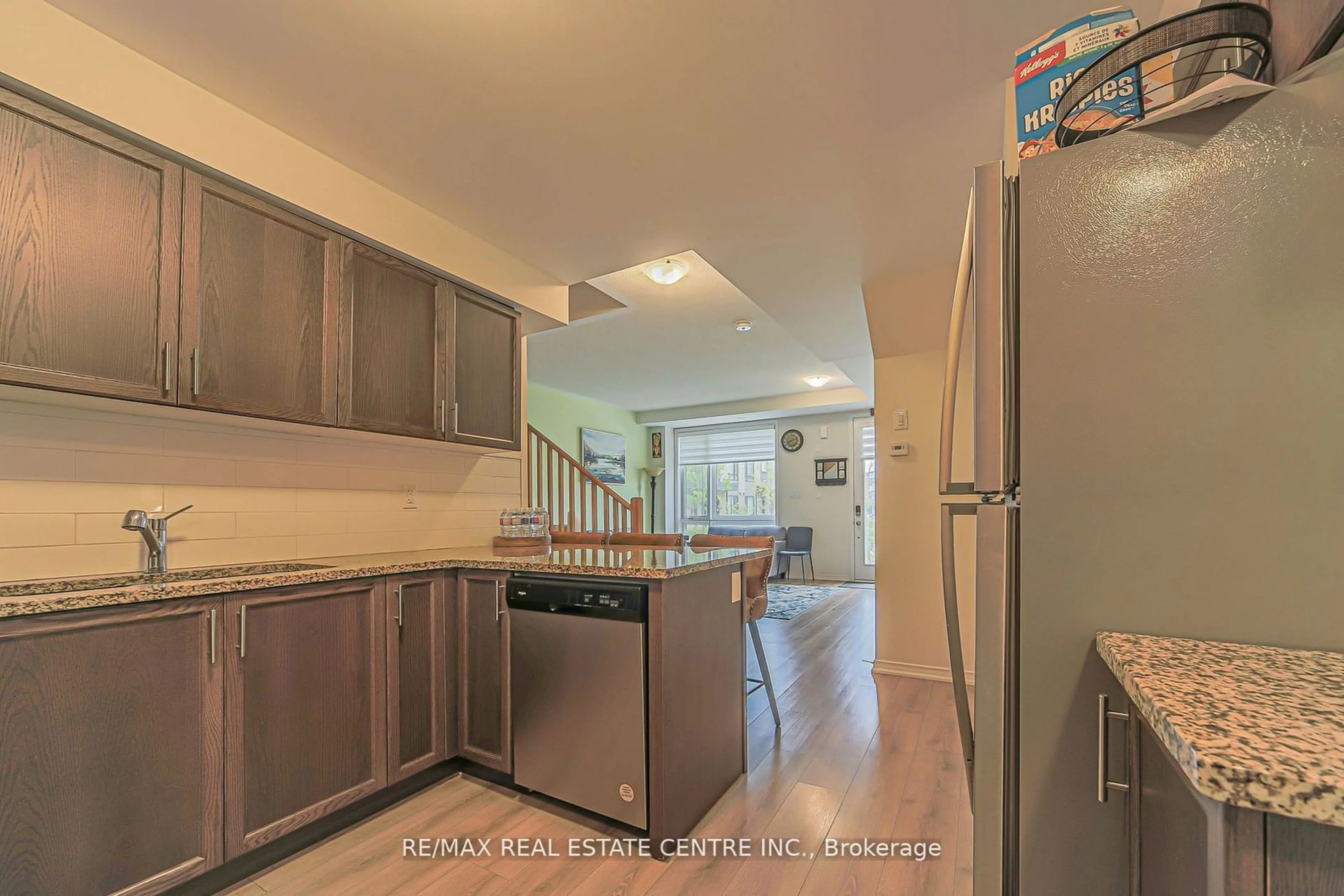 Kitchen with laundary machines, cement floor for 20 Woodstream Dr #8, Toronto Ontario M9W 0G1