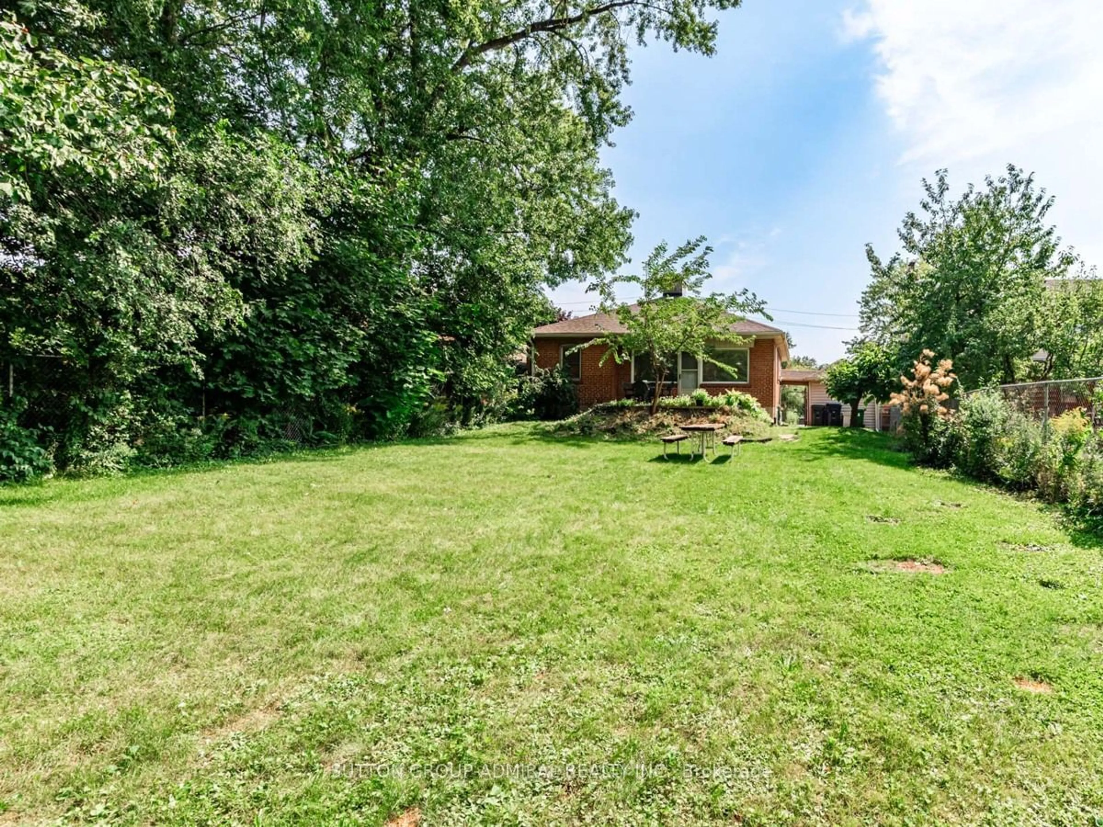 Frontside or backside of a home, the fenced backyard for 86 North Park Dr, Toronto Ontario M6L 1K2