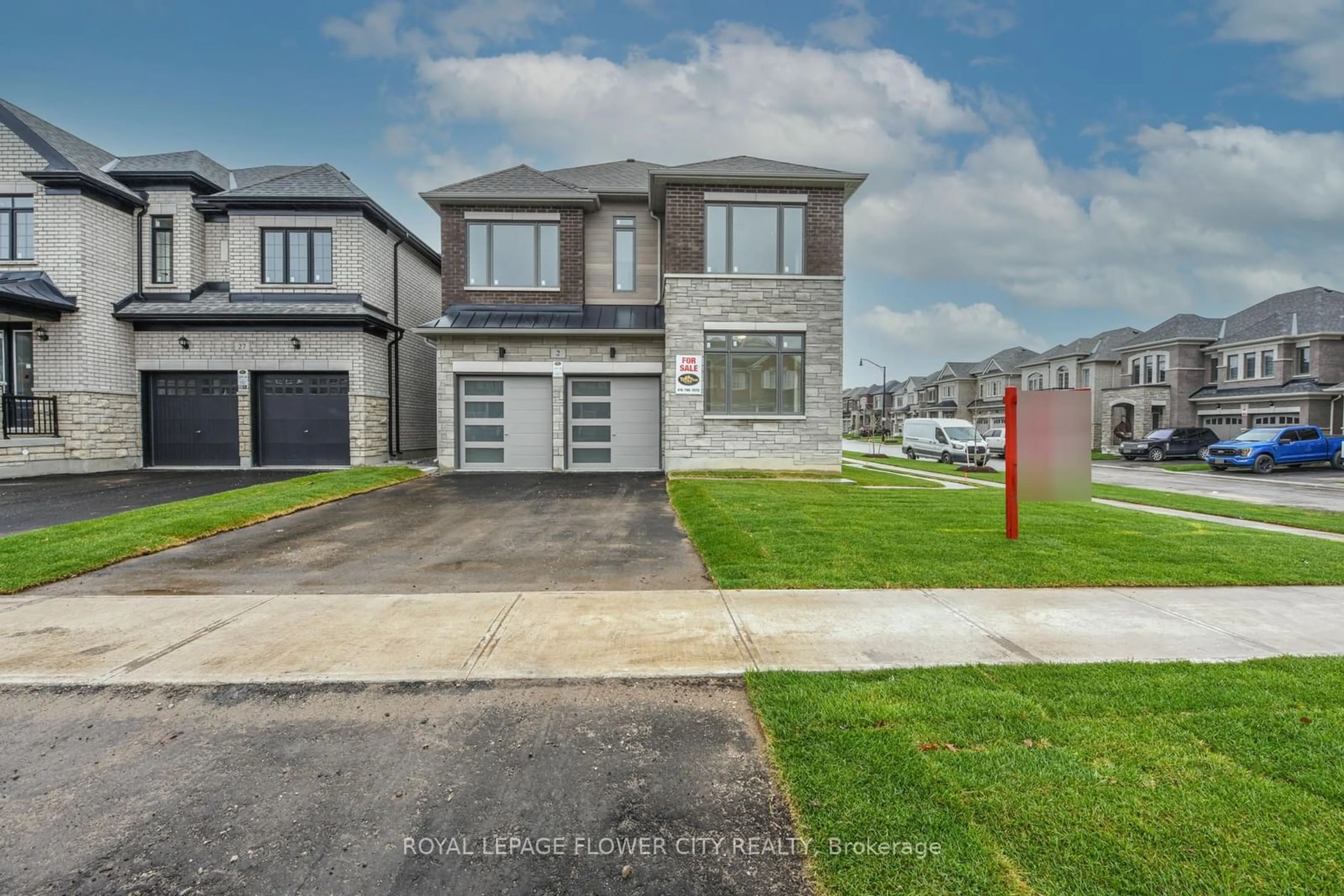 Frontside or backside of a home, the street view for 2 Dolomite Dr, Brampton Ontario L6P 4R6