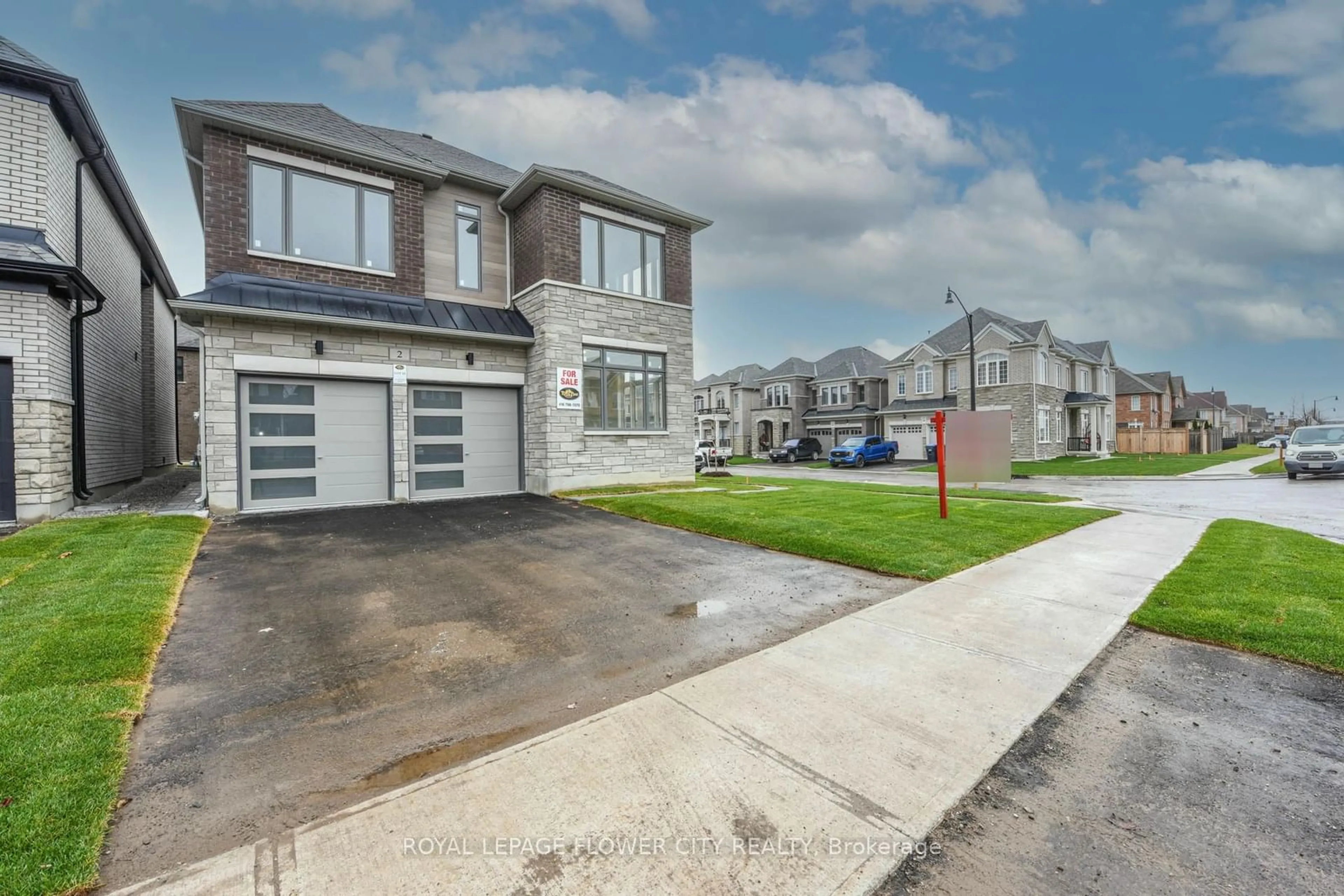 Frontside or backside of a home, the street view for 2 Dolomite Dr, Brampton Ontario L6P 4R6