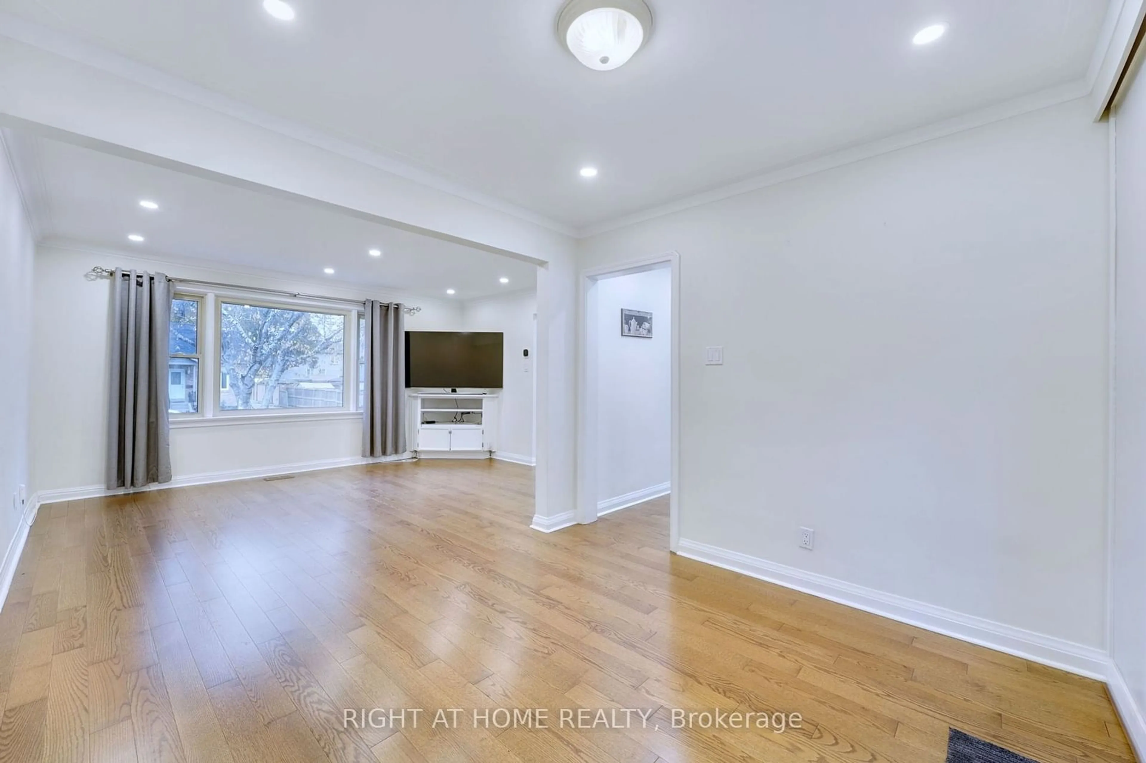 A pic of a room, wood floors for 6 Adele Ave, Toronto Ontario M3L 1J1