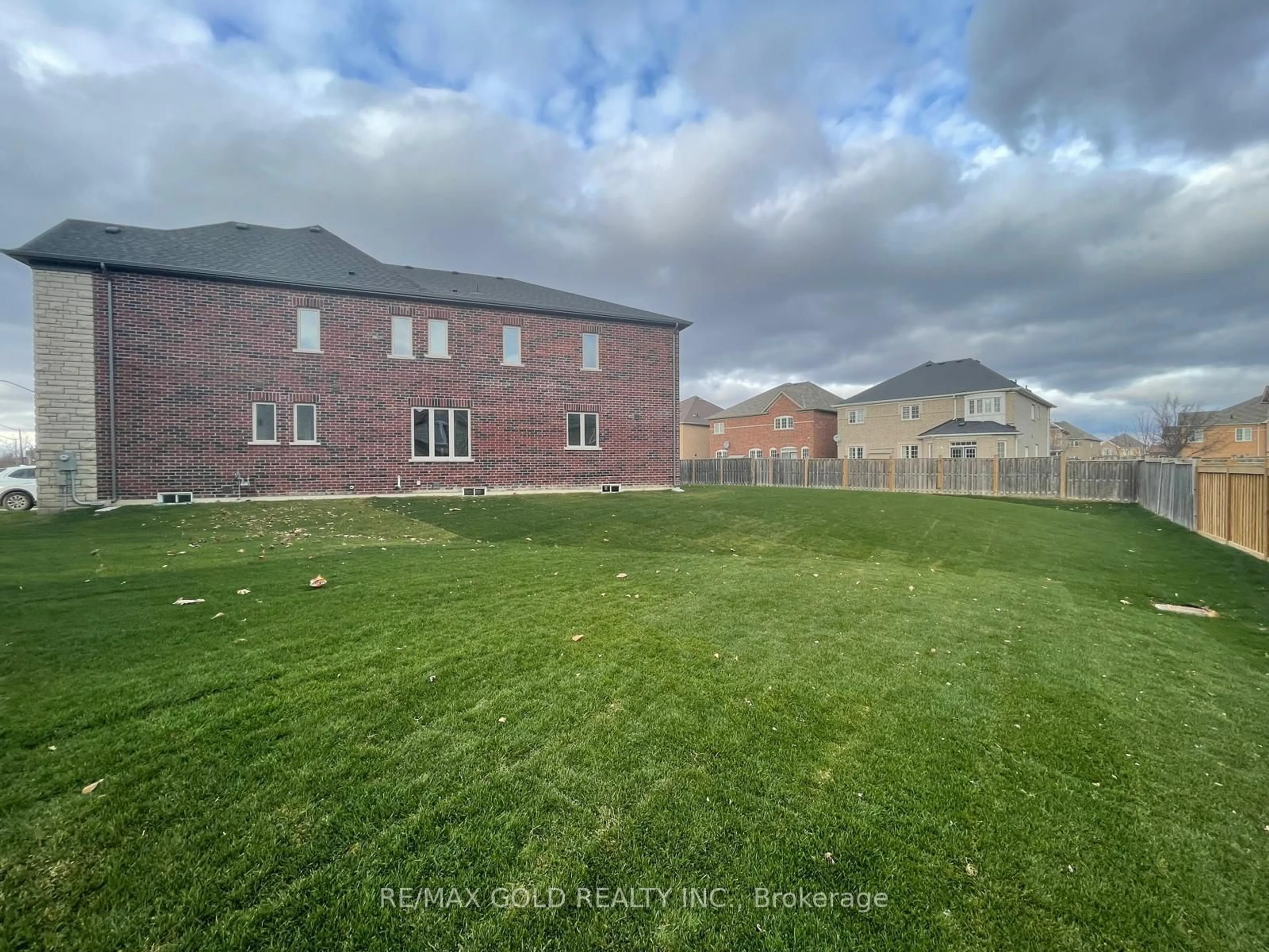 Frontside or backside of a home, the fenced backyard for 31 Dolomite Dr, Brampton Ontario L6P 4R6