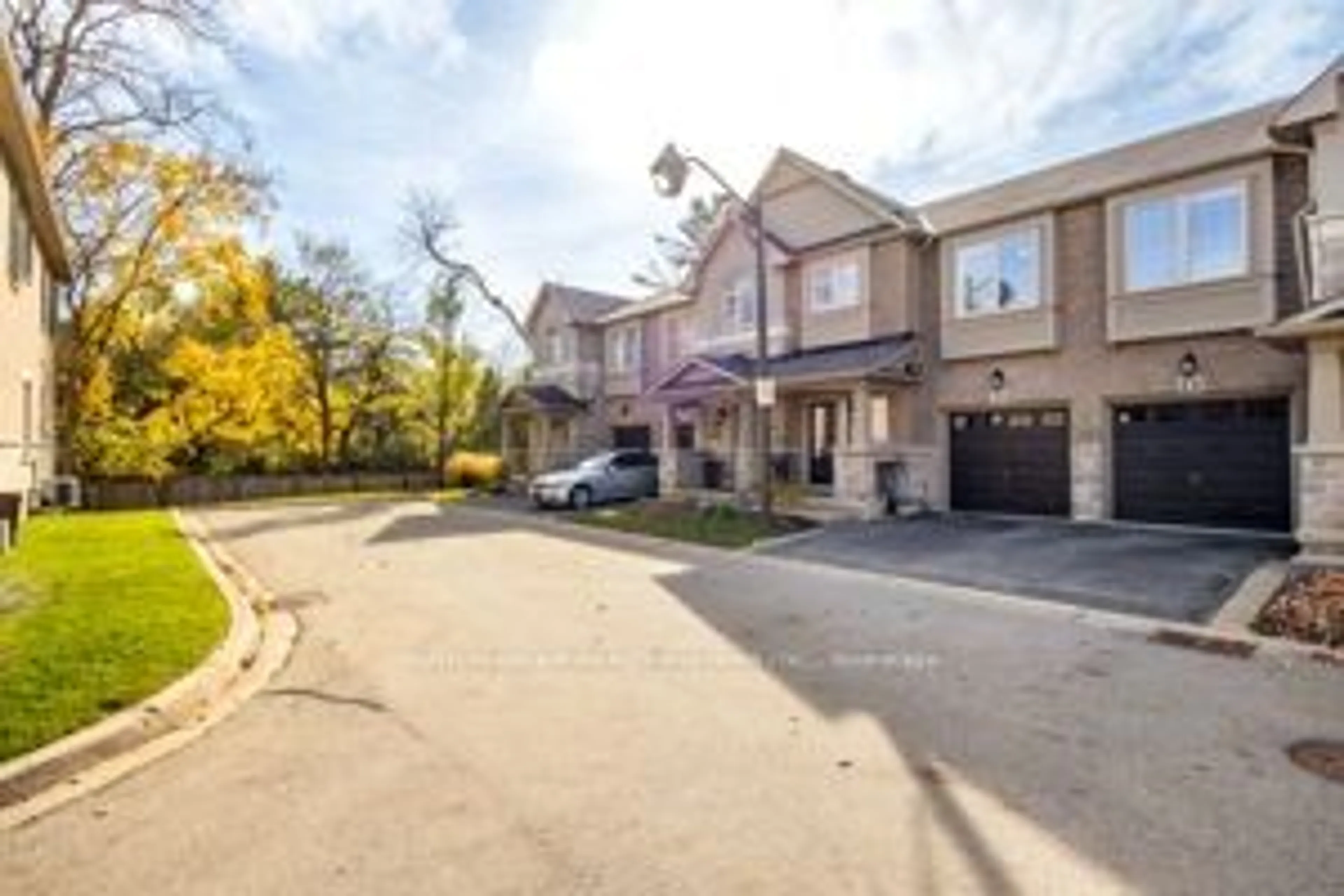 A pic from exterior of the house or condo, the street view for 2086 Ghent Ave #21, Burlington Ontario L7R 0E1