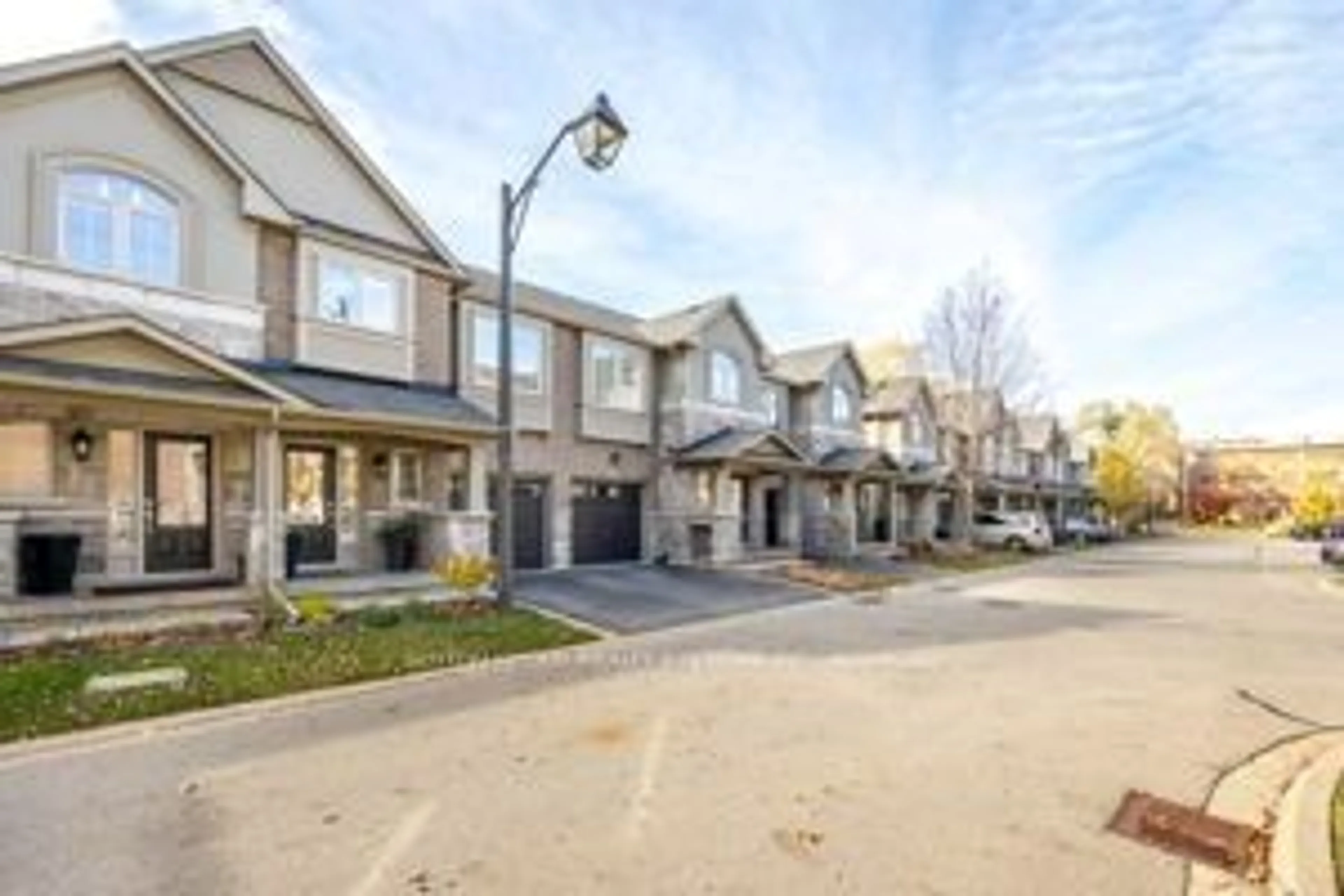 A pic from exterior of the house or condo, the street view for 2086 Ghent Ave #21, Burlington Ontario L7R 0E1