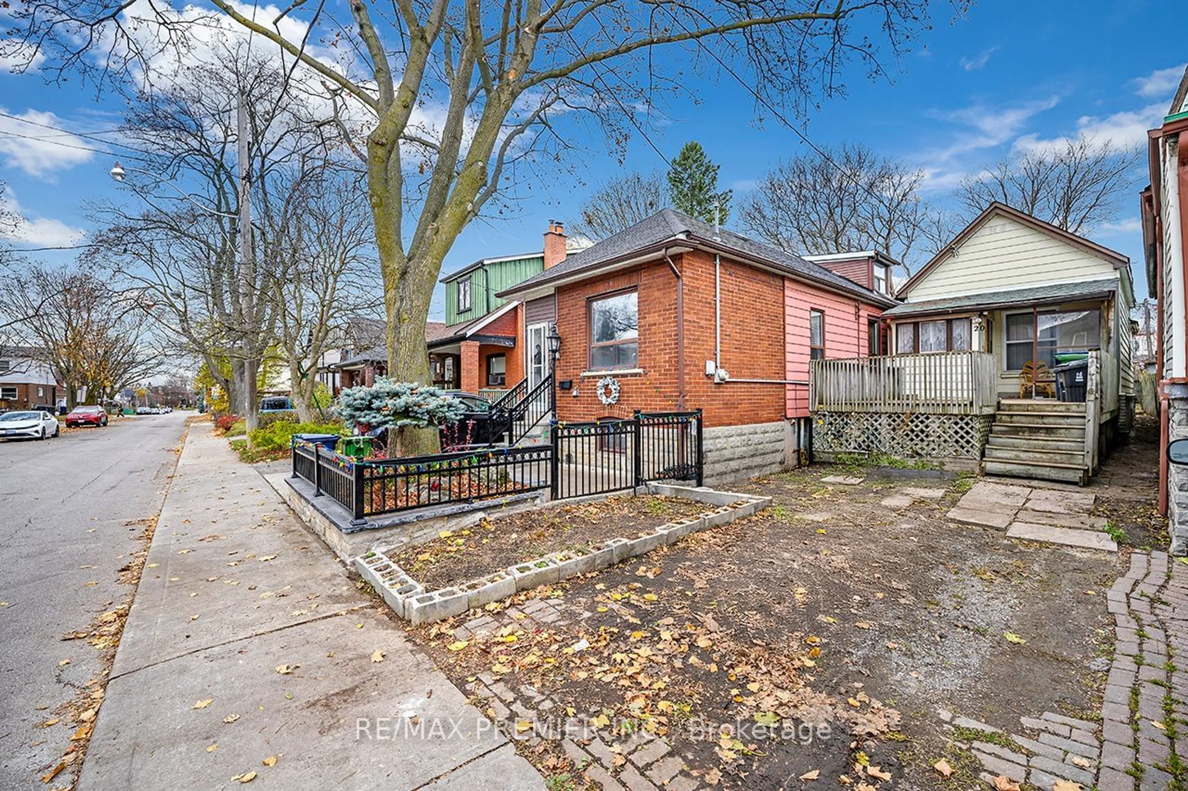 A pic from exterior of the house or condo, the fenced backyard for 20 Howick Ave, Toronto Ontario M6N 1M8