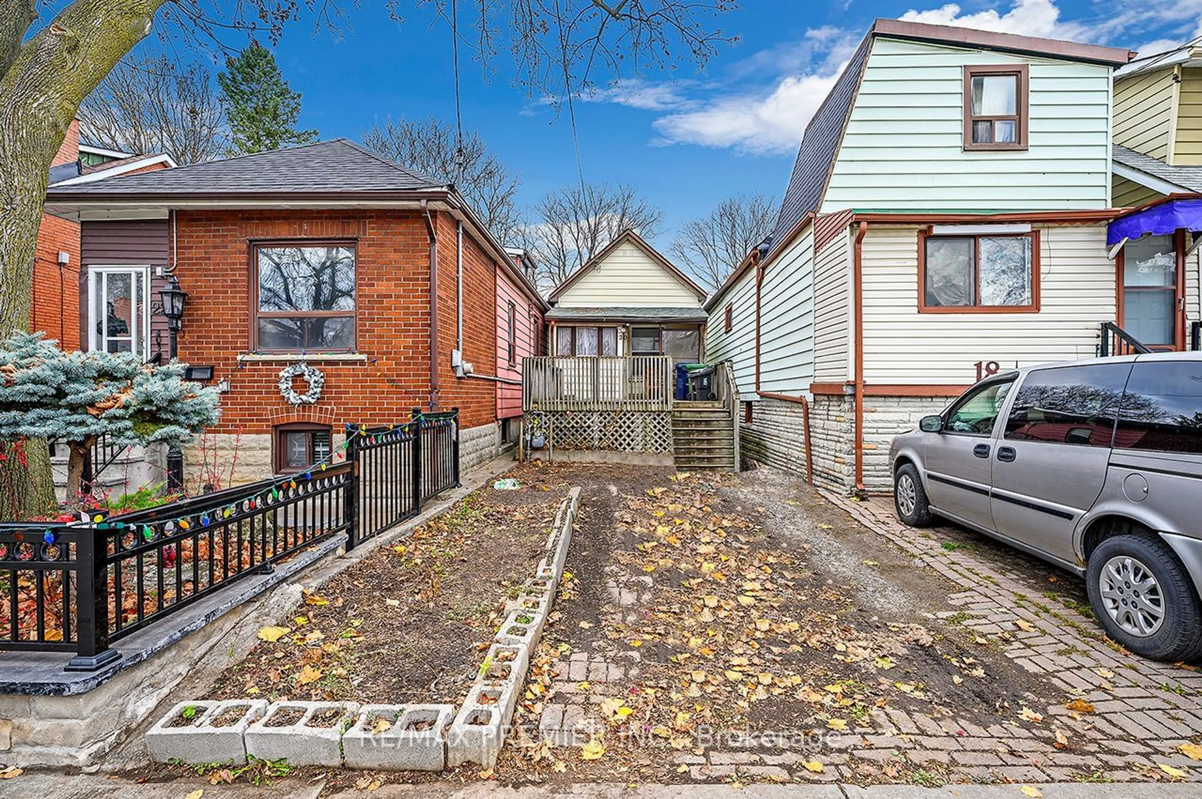 A pic from exterior of the house or condo, the fenced backyard for 20 Howick Ave, Toronto Ontario M6N 1M8