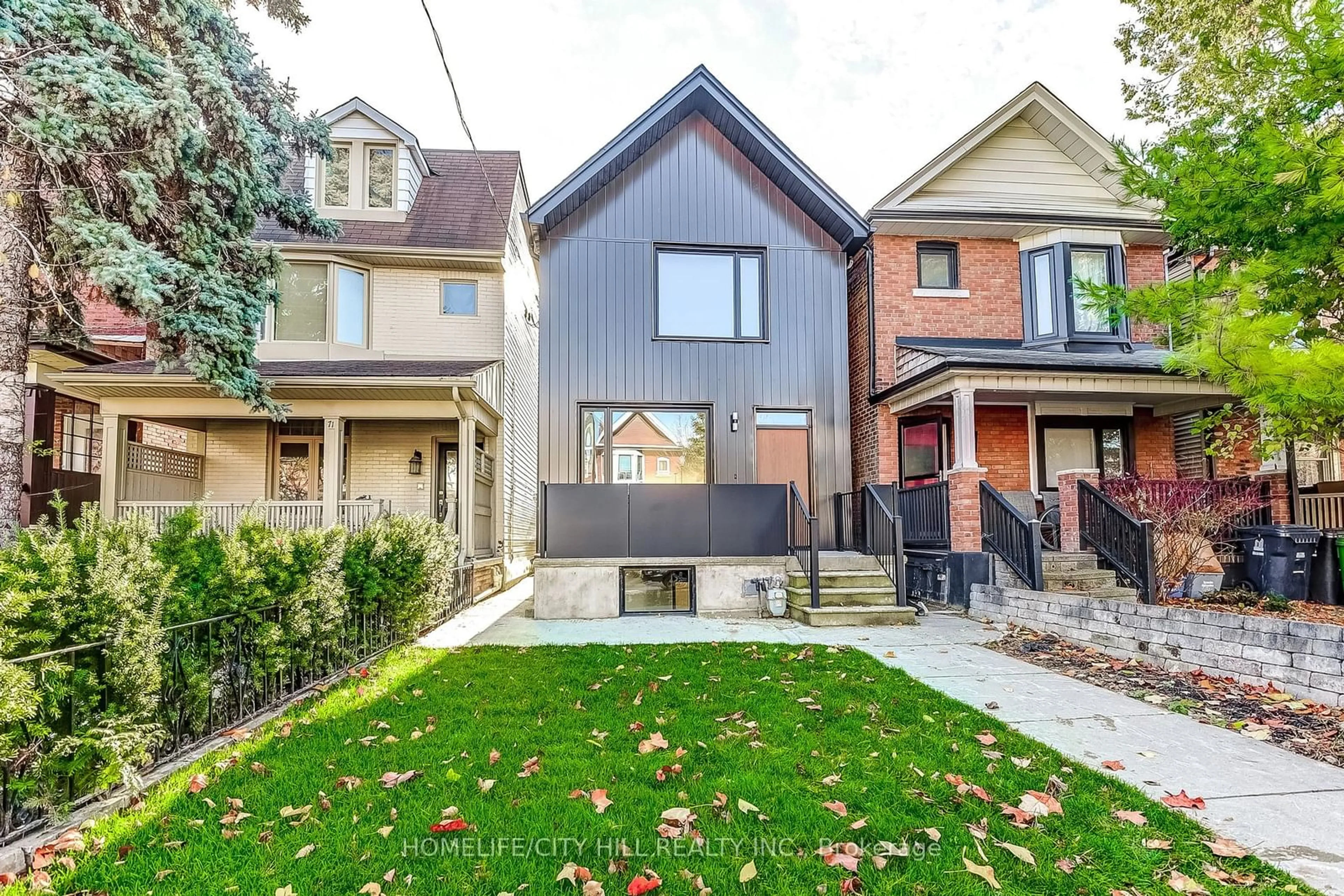 Frontside or backside of a home, the fenced backyard for 73 Melville Ave, Toronto Ontario M6G 3R3