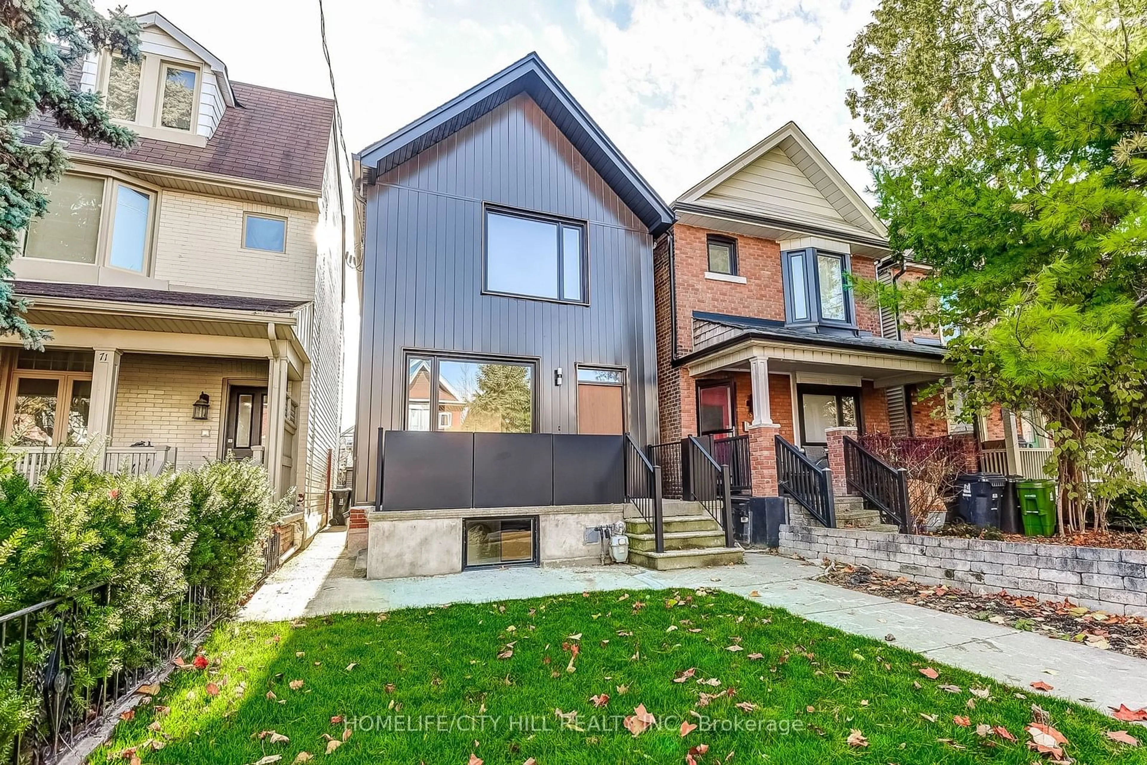 A pic from exterior of the house or condo, the fenced backyard for 73 Melville Ave, Toronto Ontario M6G 3R3