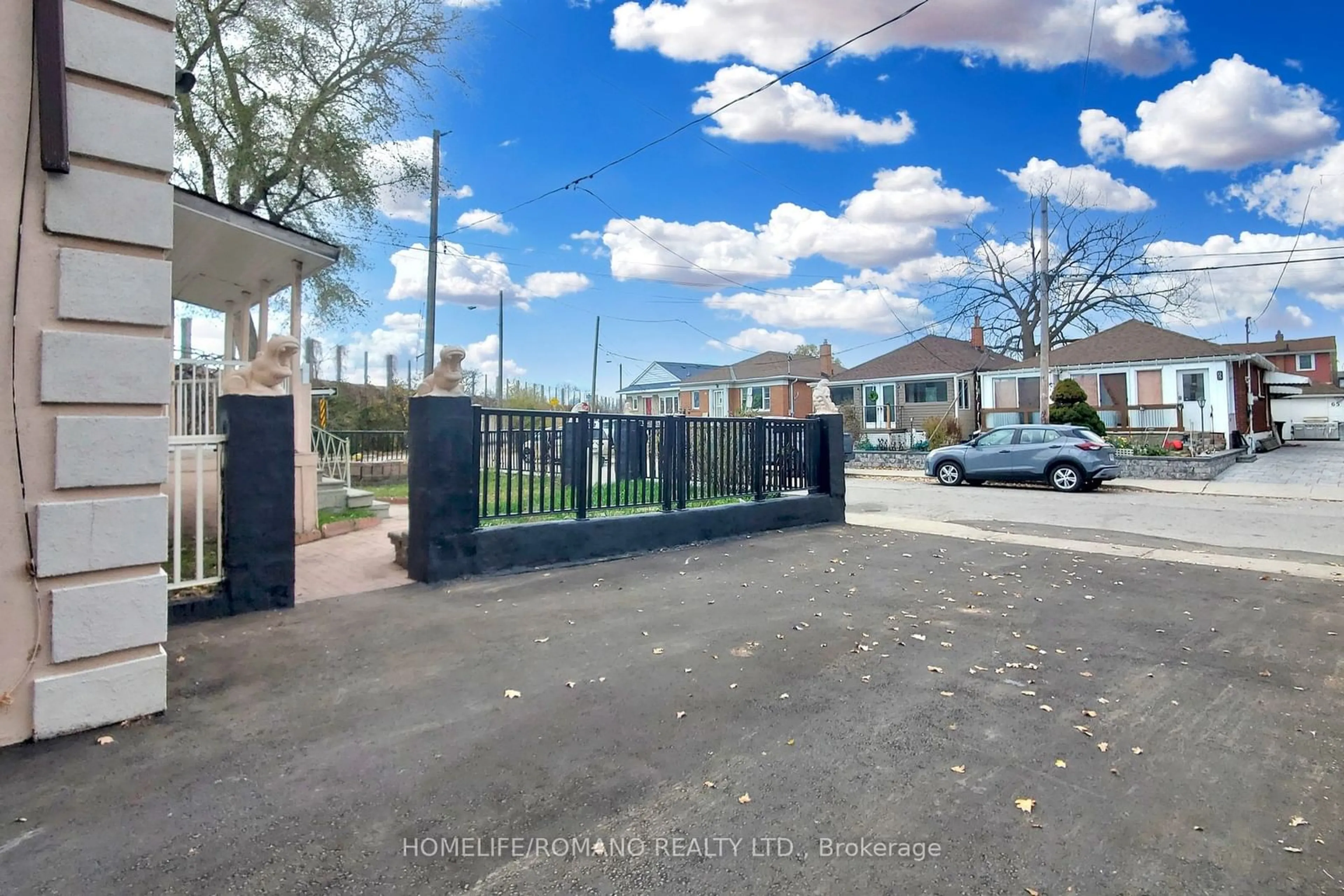 A pic from exterior of the house or condo, the fenced backyard for 66 Mahoney Ave, Toronto Ontario M6M 2H4