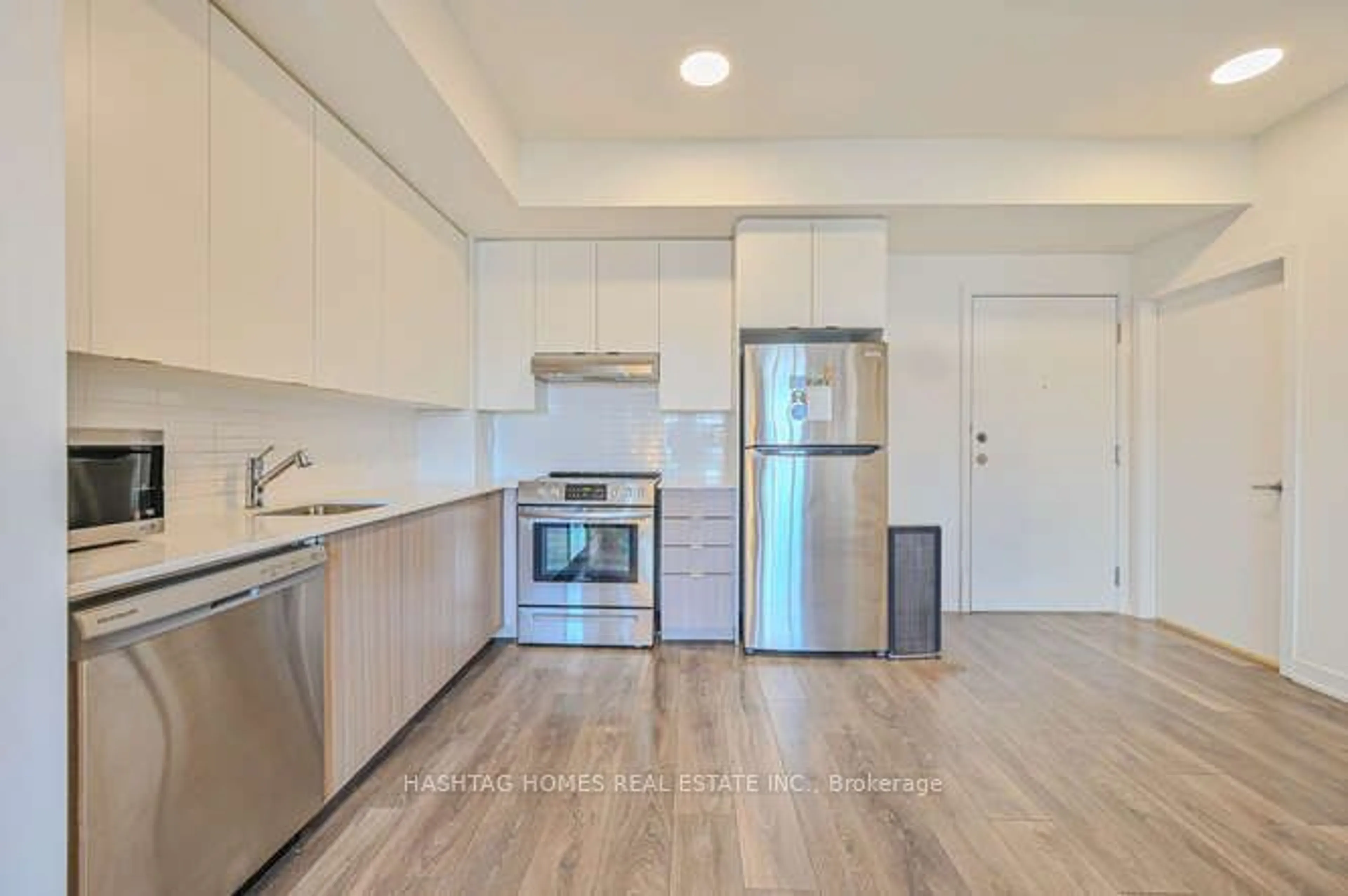 Standard kitchen, wood floors for 120 Canon Jackson Dr #404, Toronto Ontario M6M 0B8