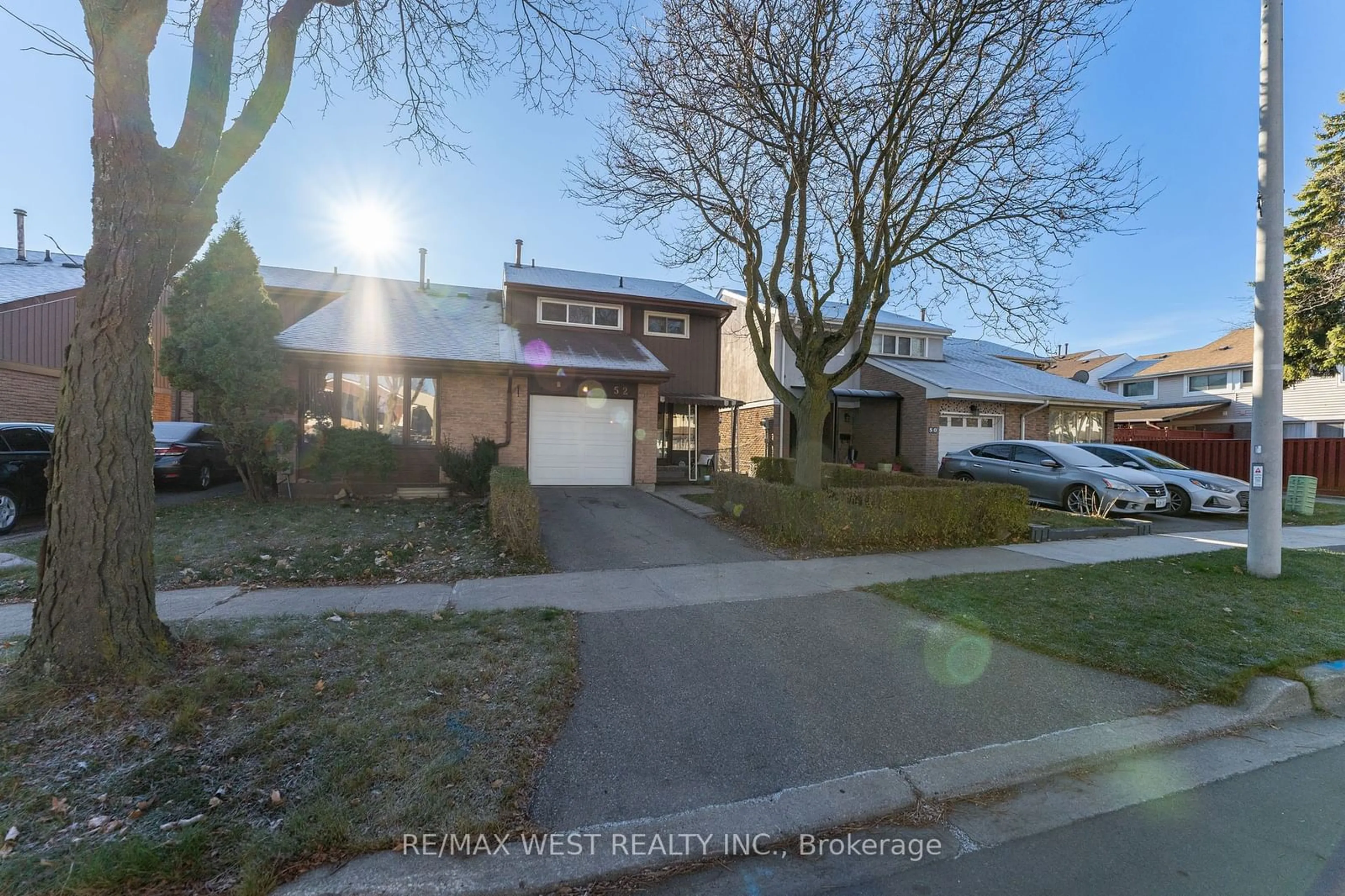 Frontside or backside of a home, the street view for 52 Wallis Cres, Toronto Ontario M9V 4K3