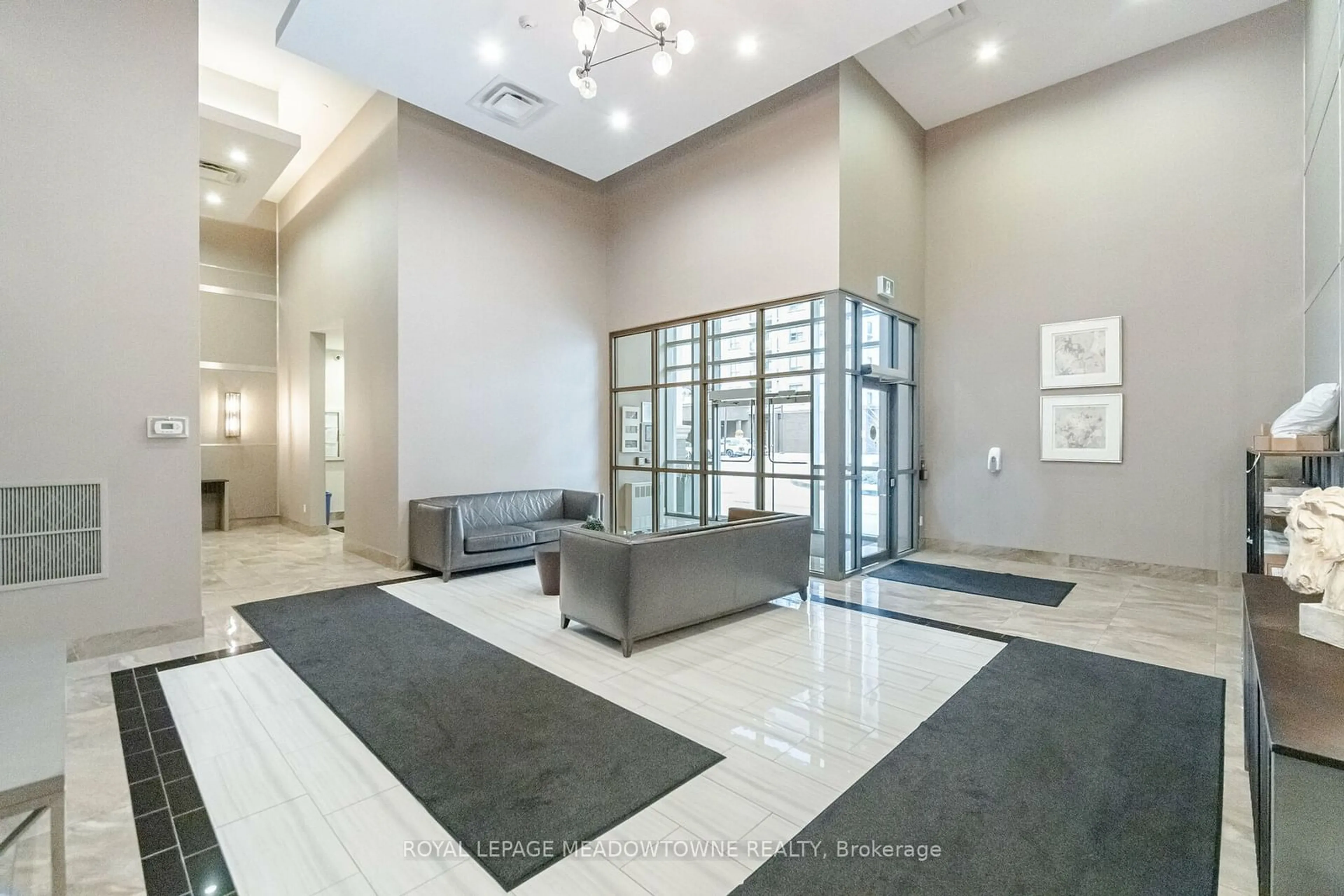 Indoor lobby, cement floor for 2490 Old Bronte Rd #406, Oakville Ontario L6M 0Y5