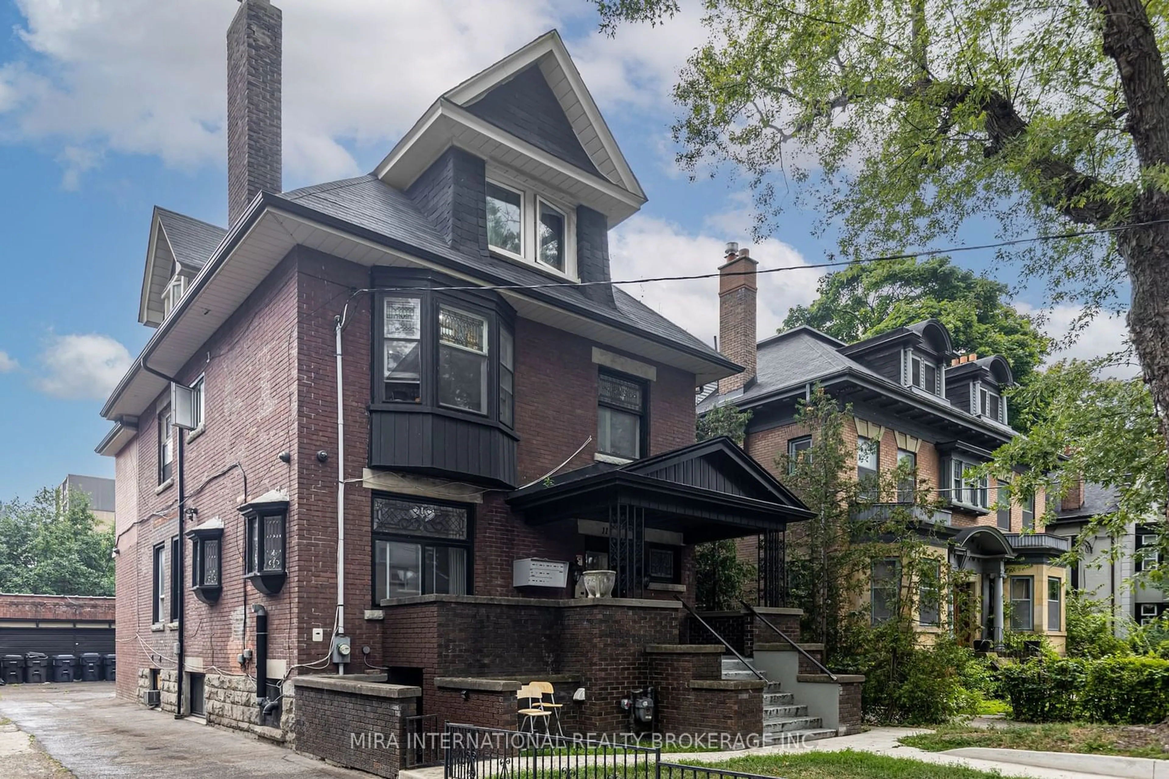 Home with brick exterior material for 11 Laxton Ave, Toronto Ontario M6K 1K8