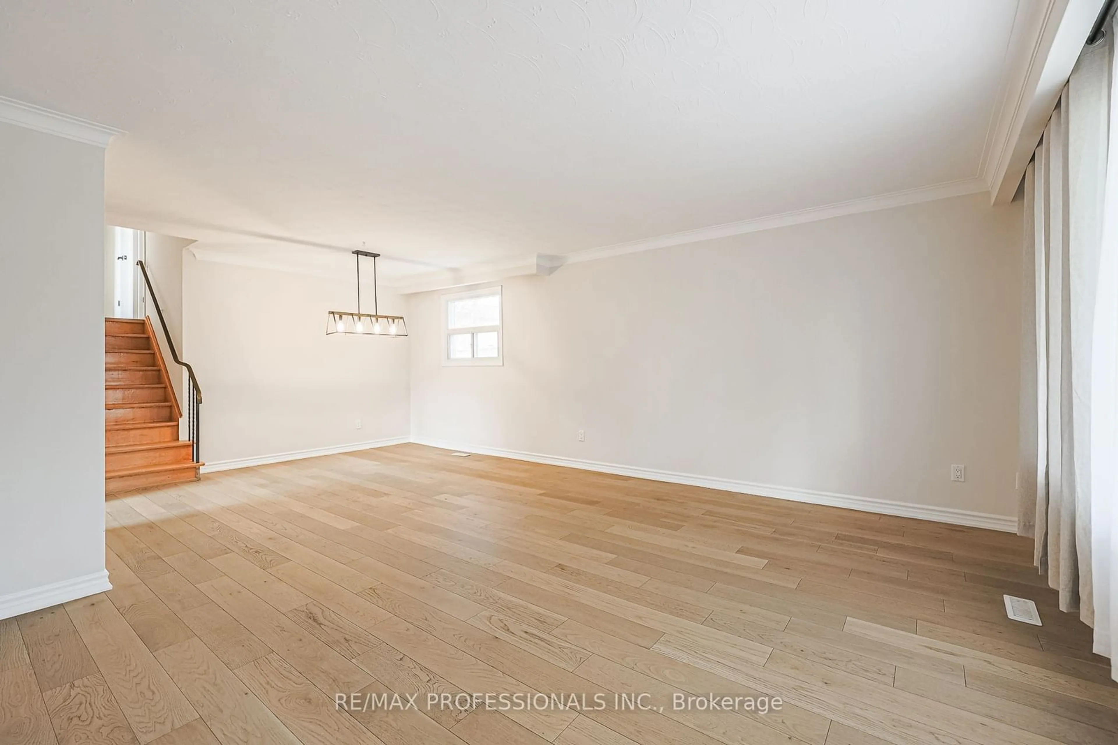 A pic of a room, wood floors for 18 West Wareside Rd, Toronto Ontario M9C 3J1