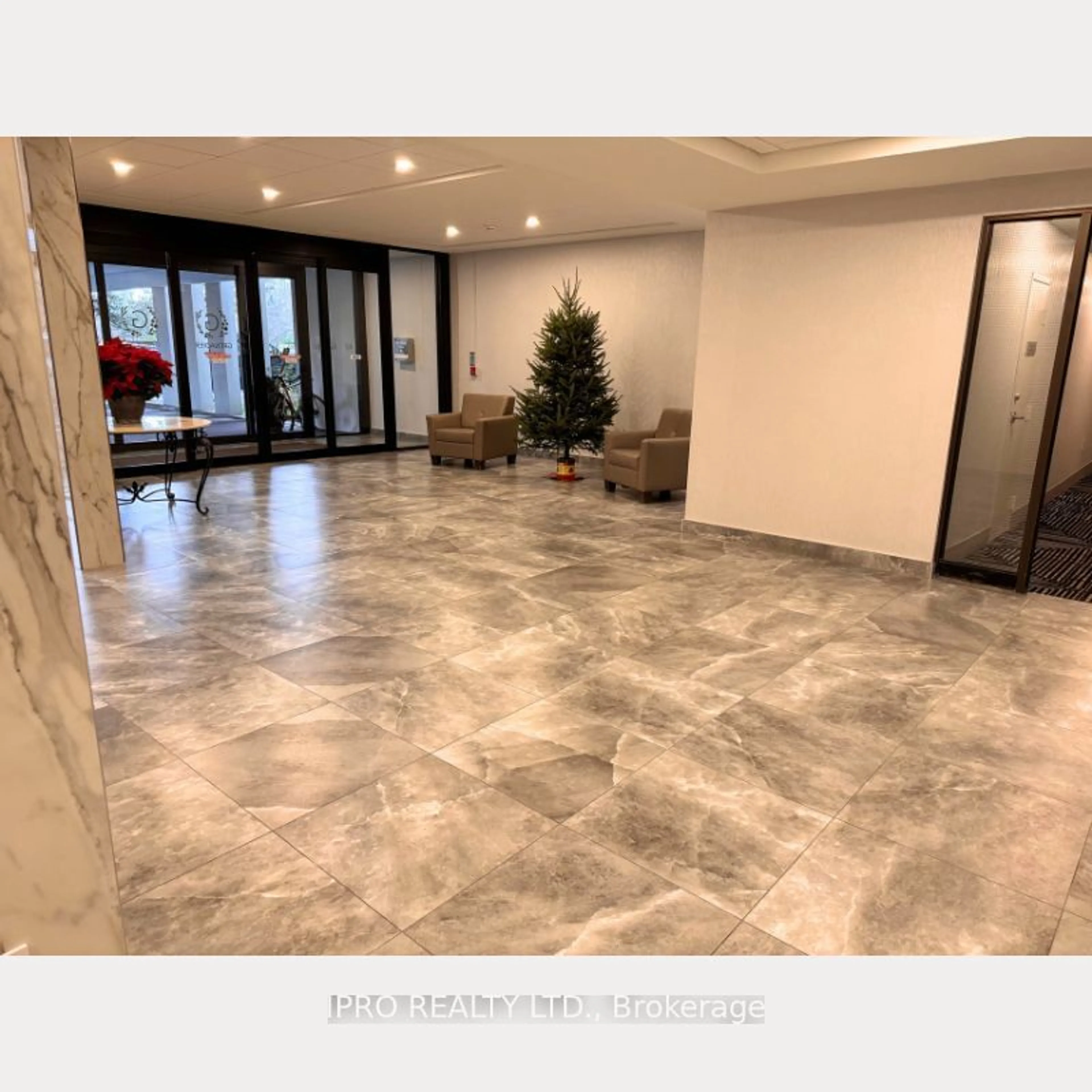 Indoor lobby, ceramic floors for 65 Southport St #606, Toronto Ontario M6S 3N6