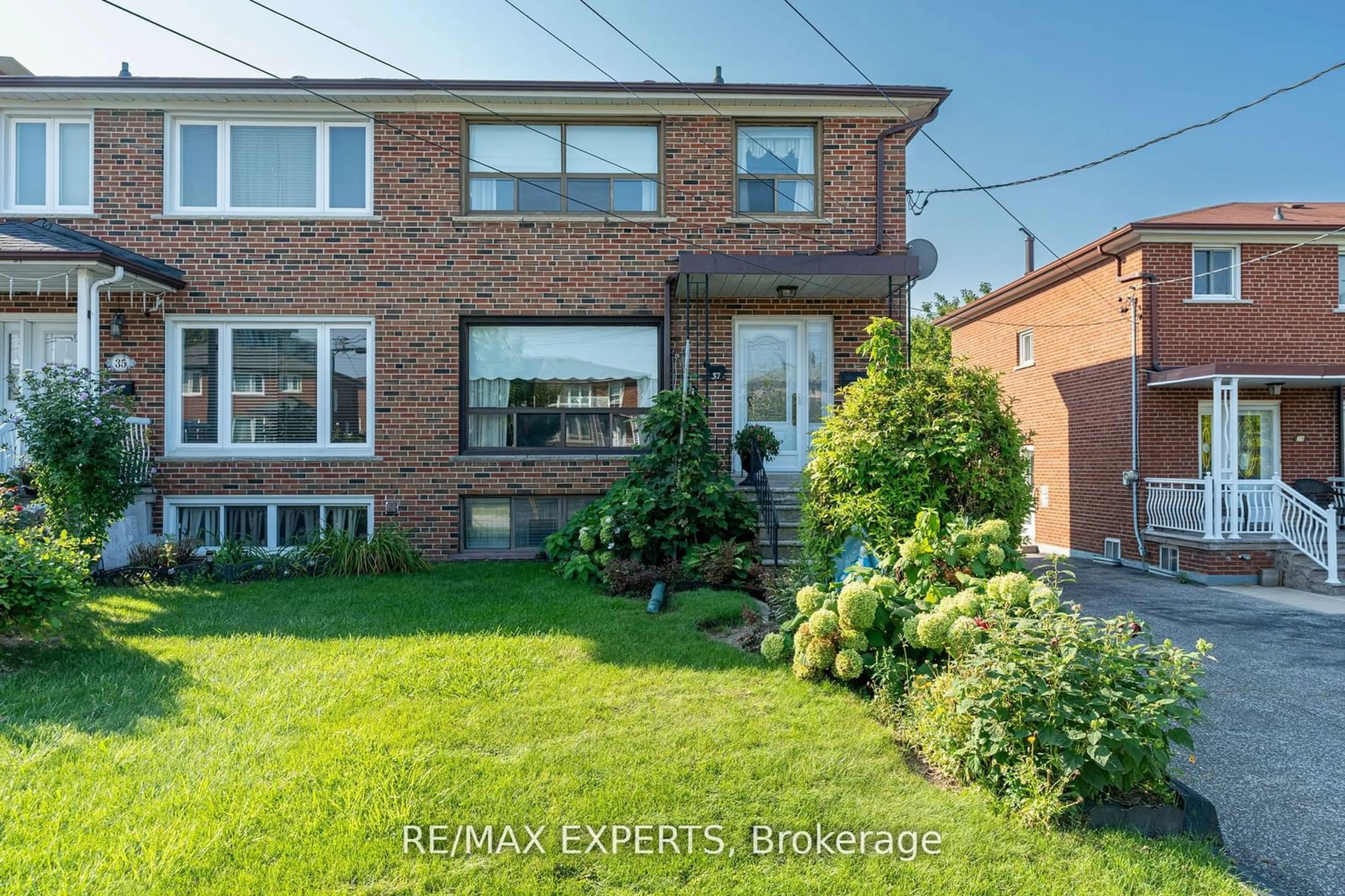 Frontside or backside of a home, the fenced backyard for 37 Donofree Rd, Toronto Ontario M6L 2P4