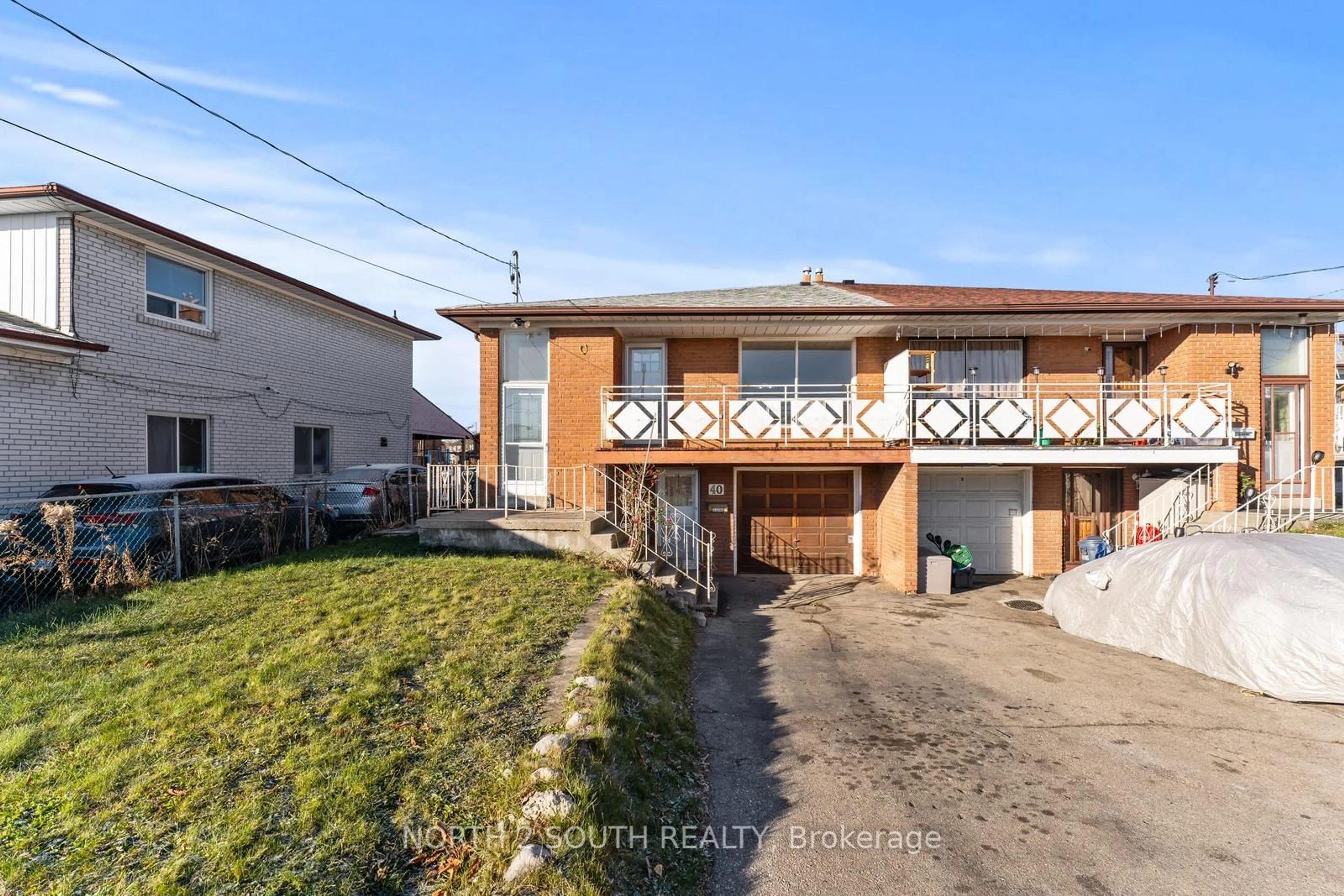 Frontside or backside of a home, the street view for 40 Brubeck Rd, Toronto Ontario M9M 1W7