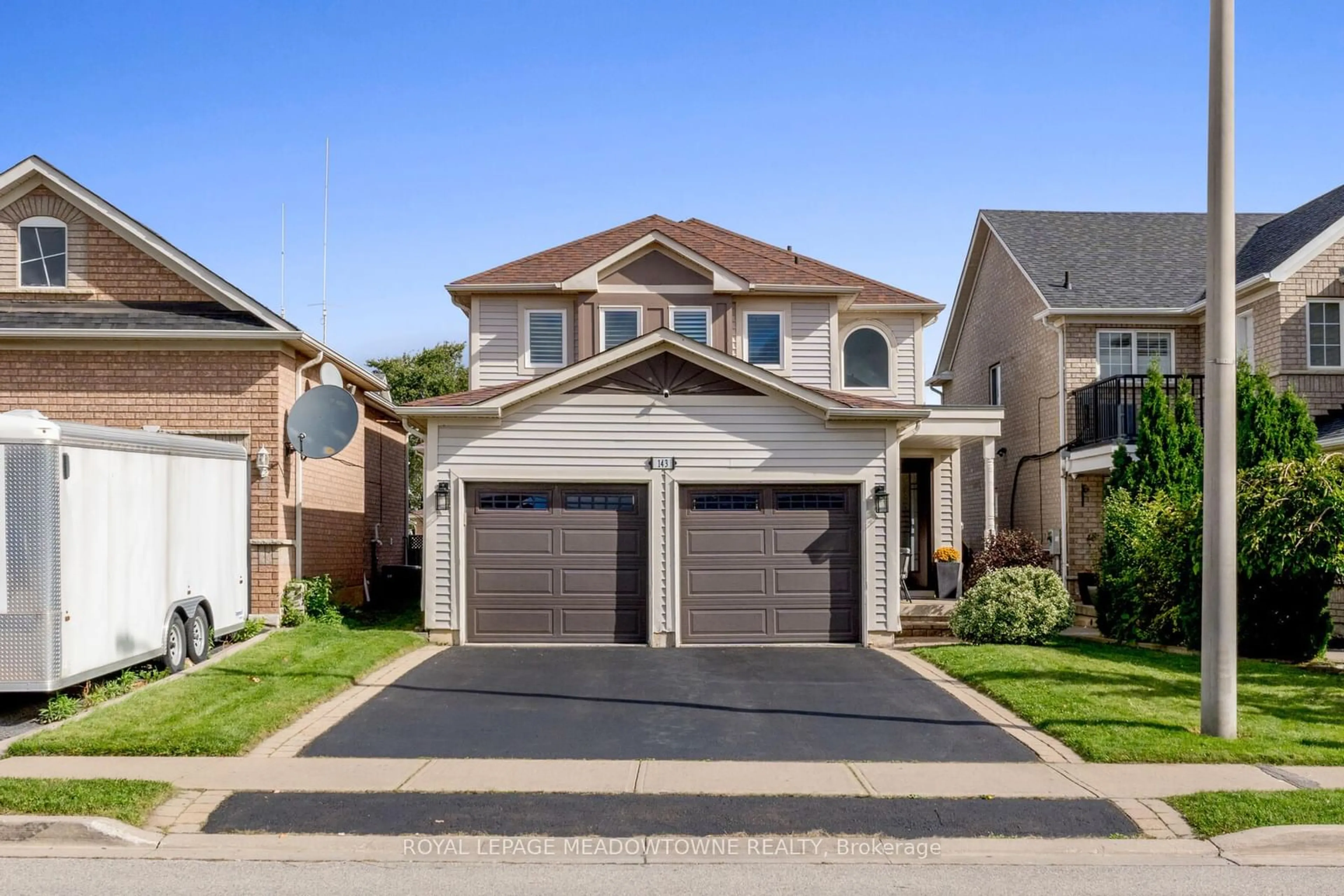 Frontside or backside of a home, the street view for 143 Porchlight Rd, Brampton Ontario L6X 4R7