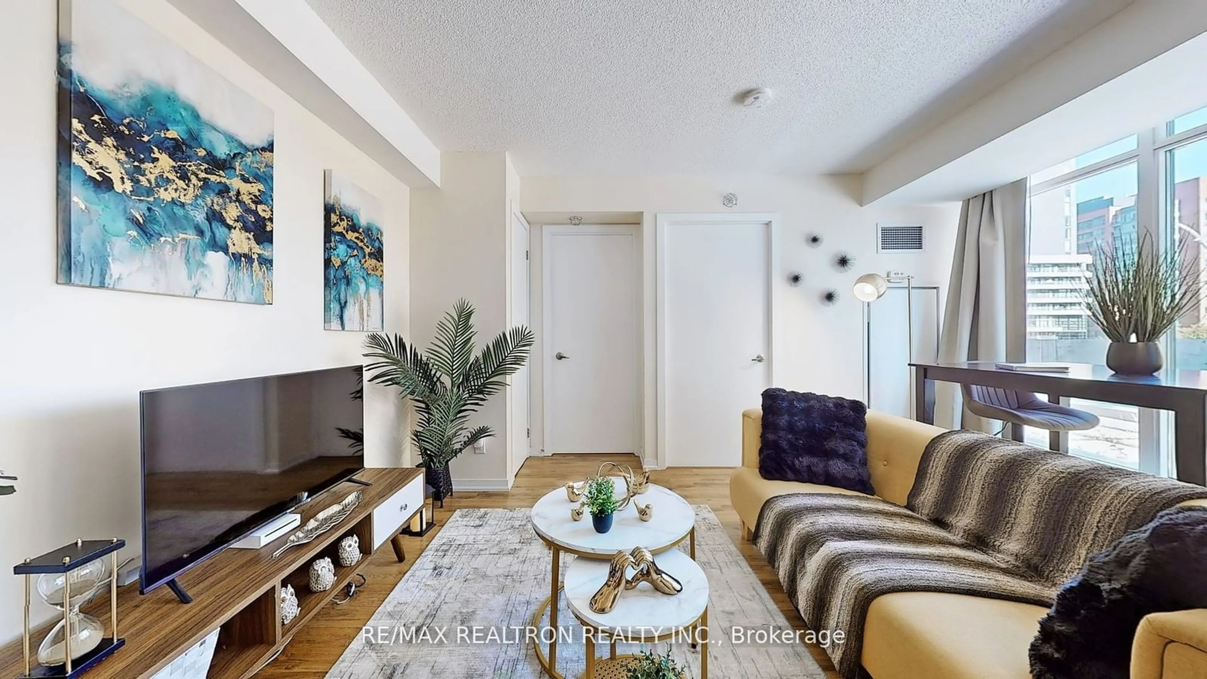 Living room, wood floors for 20 Joe Shuster Way #202, Toronto Ontario M6K 0A3