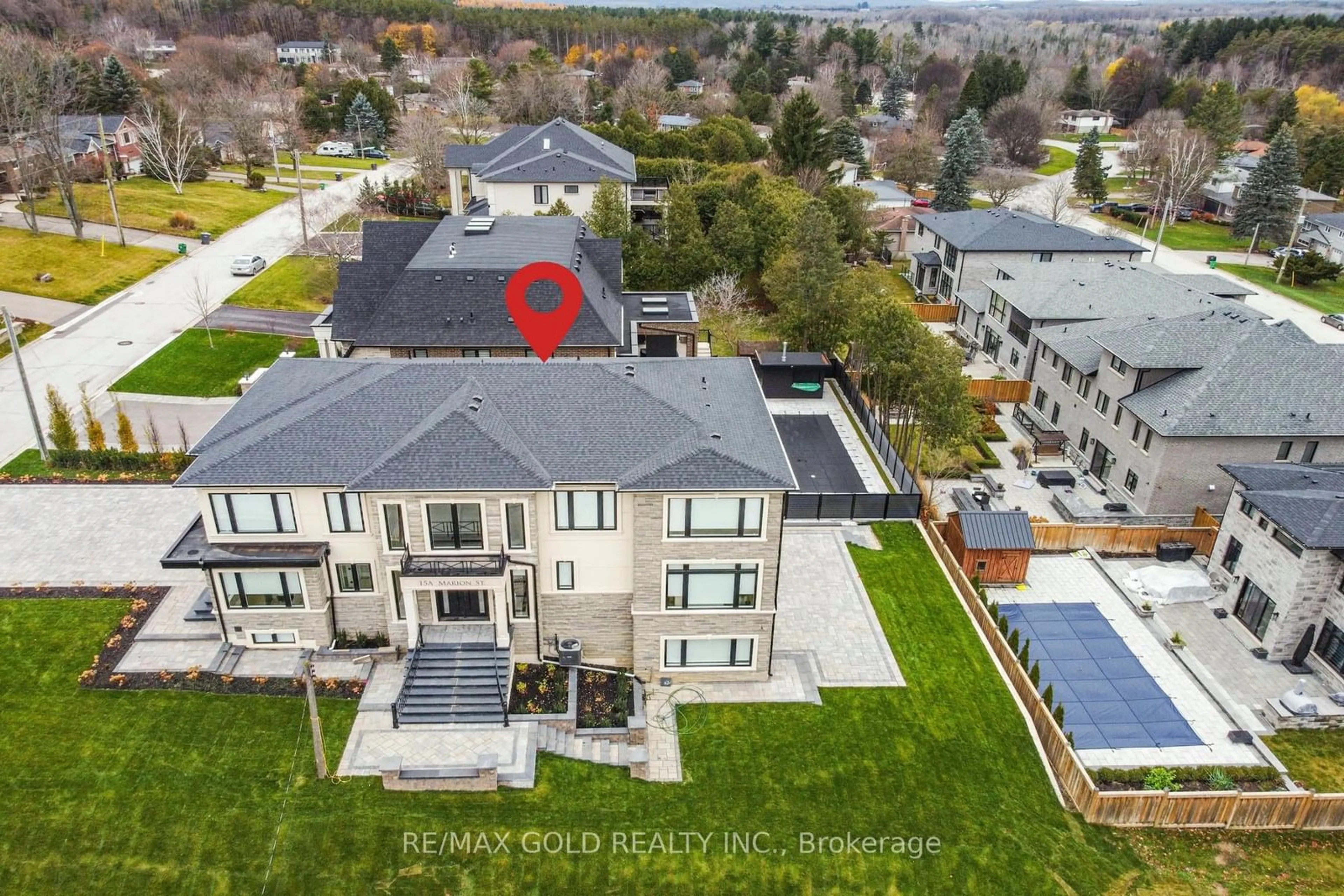 Frontside or backside of a home, the fenced backyard for 15 A Marion St, Caledon Ontario L7C 1K8