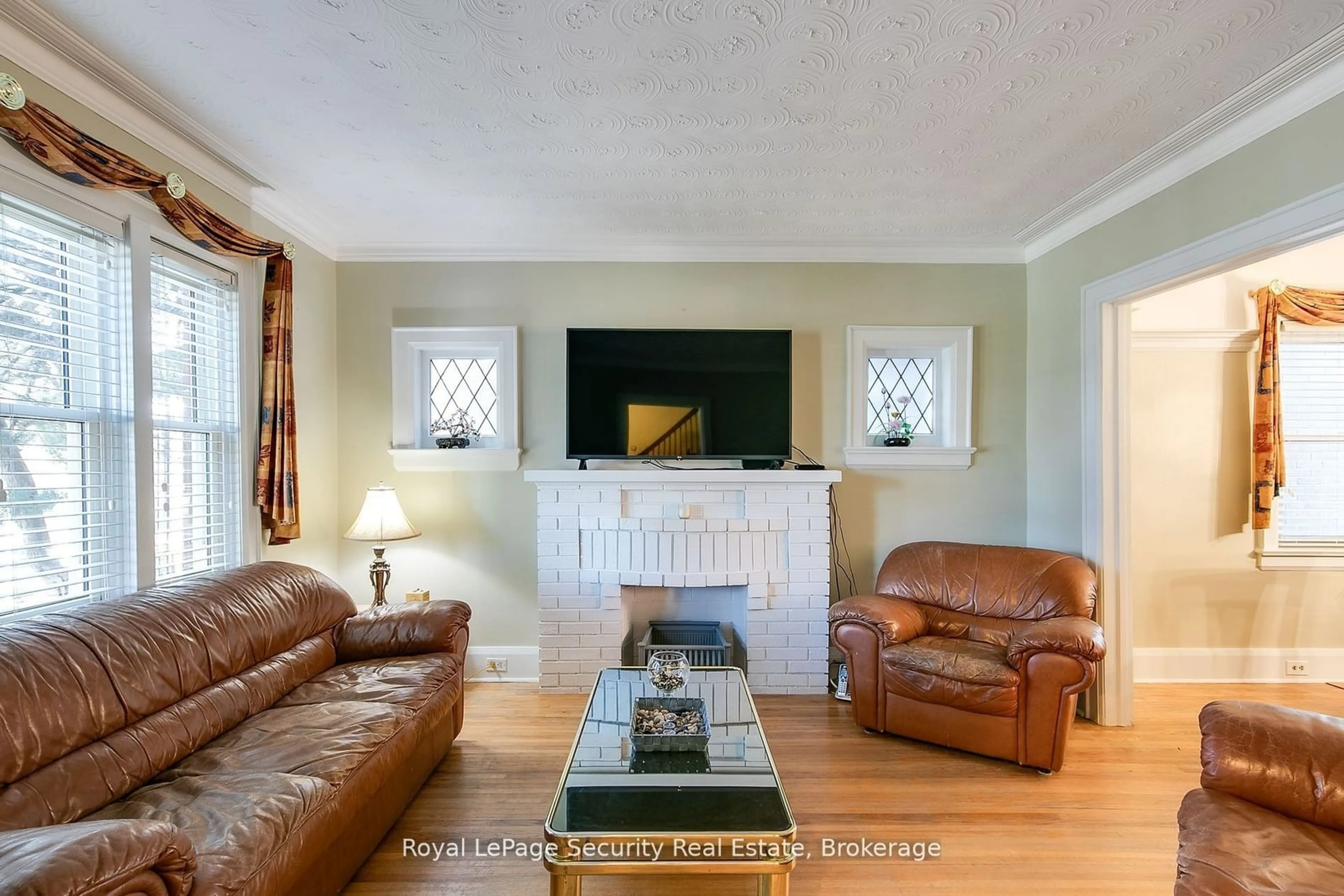 Living room, wood floors for 94 Fairbank Ave, Toronto Ontario M6E 3Y7