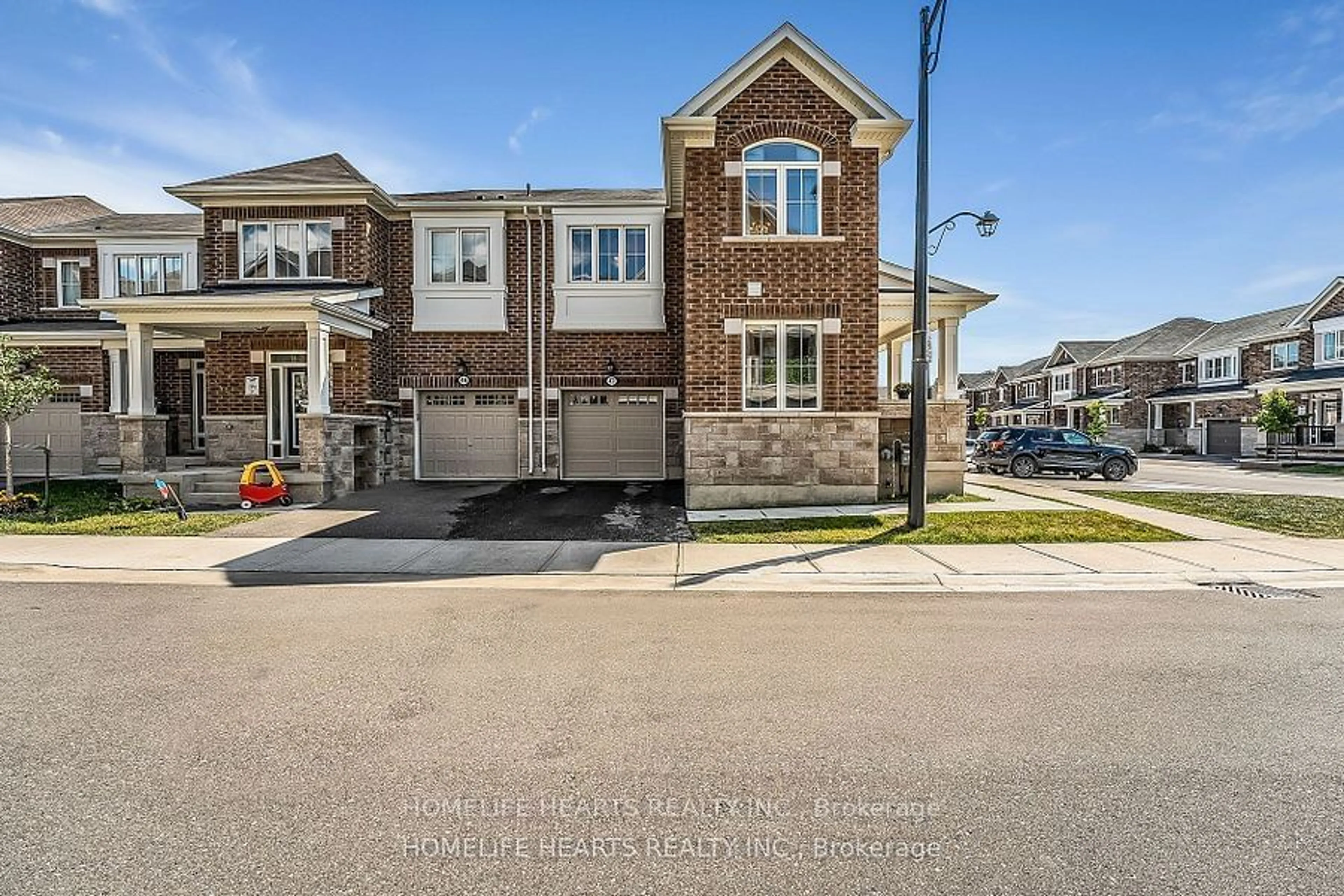 A pic from exterior of the house or condo, the street view for 975 Whitlock Ave #47, Milton Ontario L9E 1S9