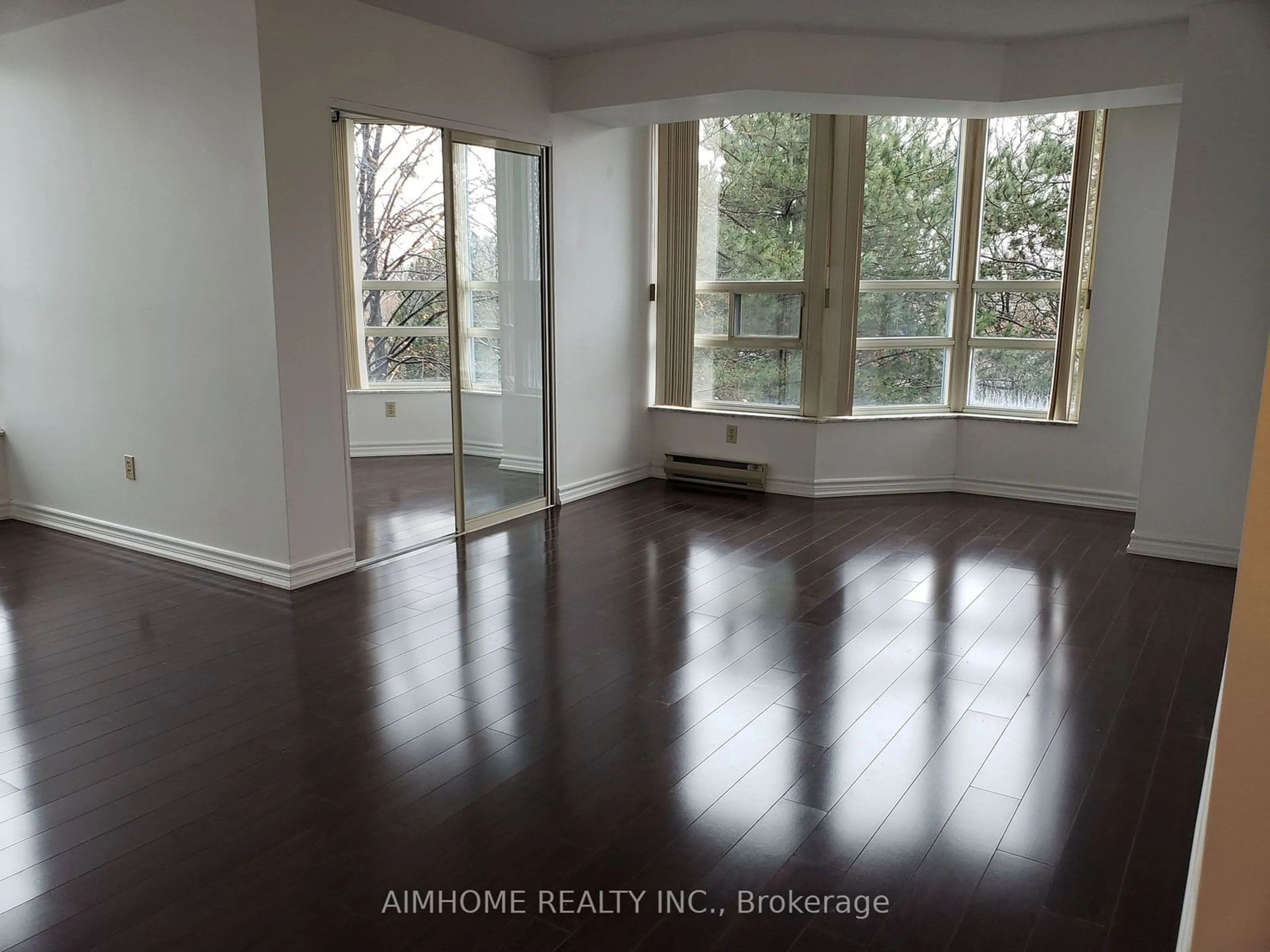 A pic of a room, wood floors for 250 Webb Dr #404, Mississauga Ontario L5B 3Z4