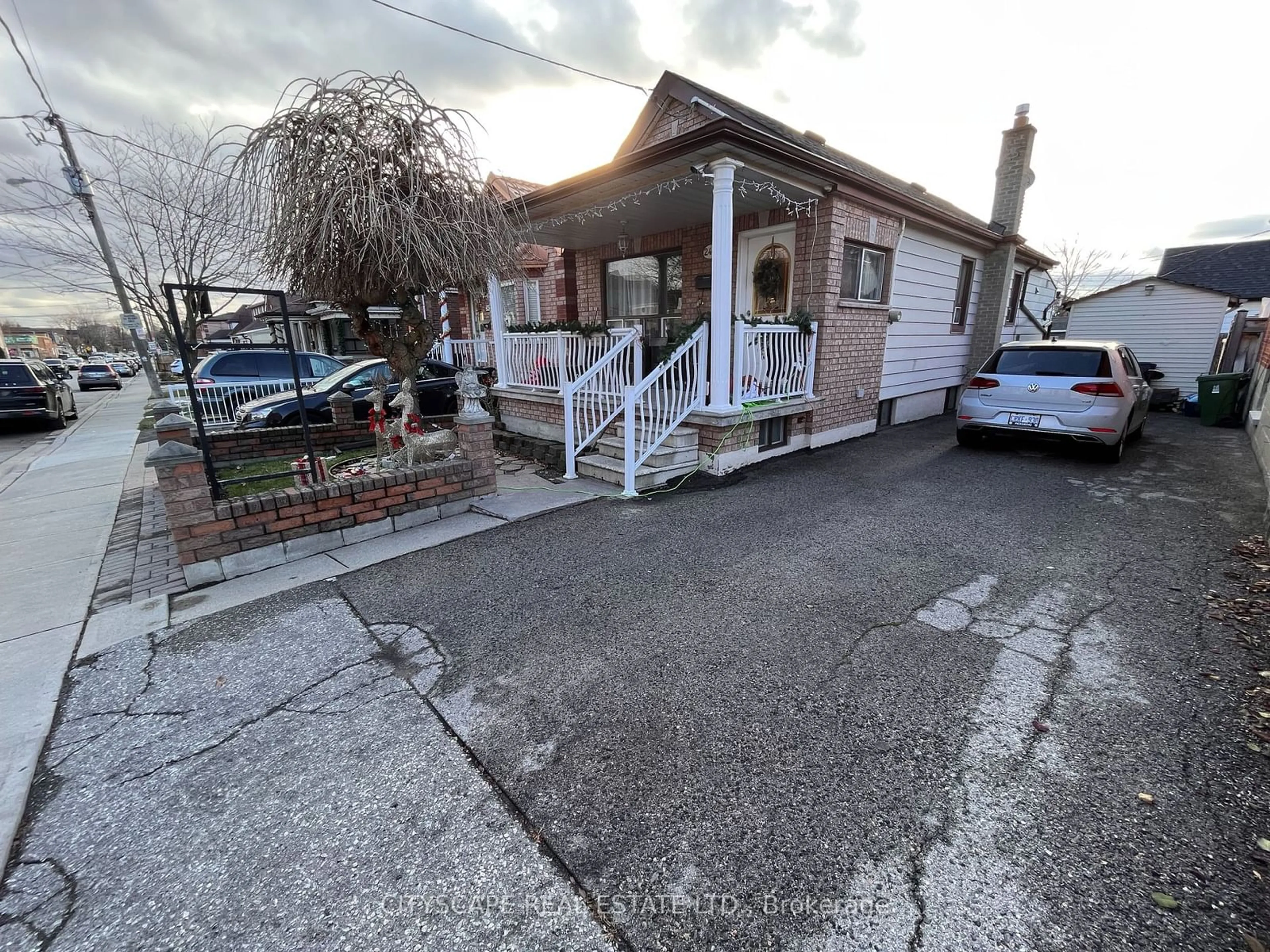 A pic from exterior of the house or condo, the street view for 244 Rosethorn Ave, Toronto Ontario M6M 3L1