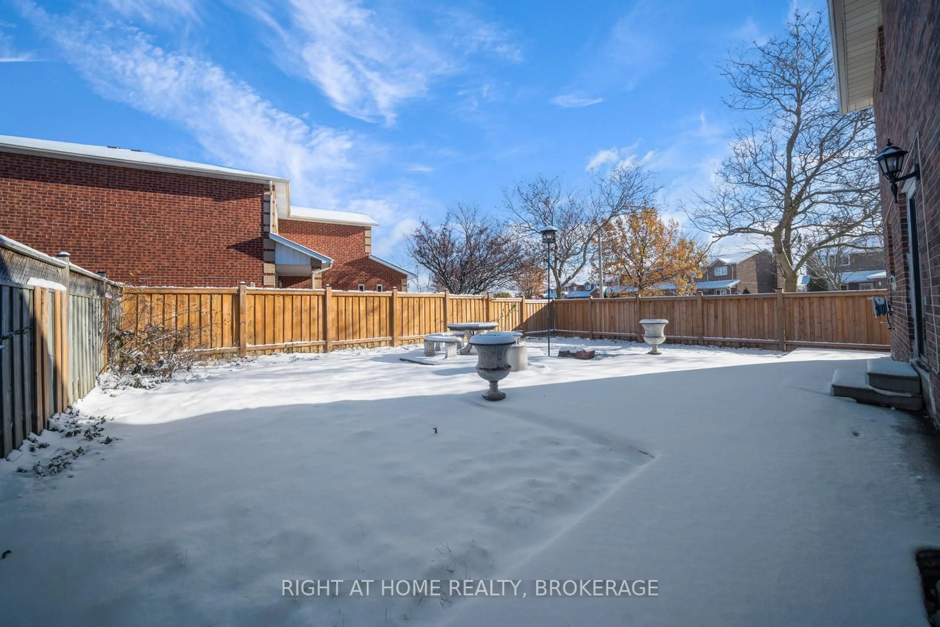 Frontside or backside of a home, the fenced backyard for 37 Sheringham St, Brampton Ontario L6Z 3P8