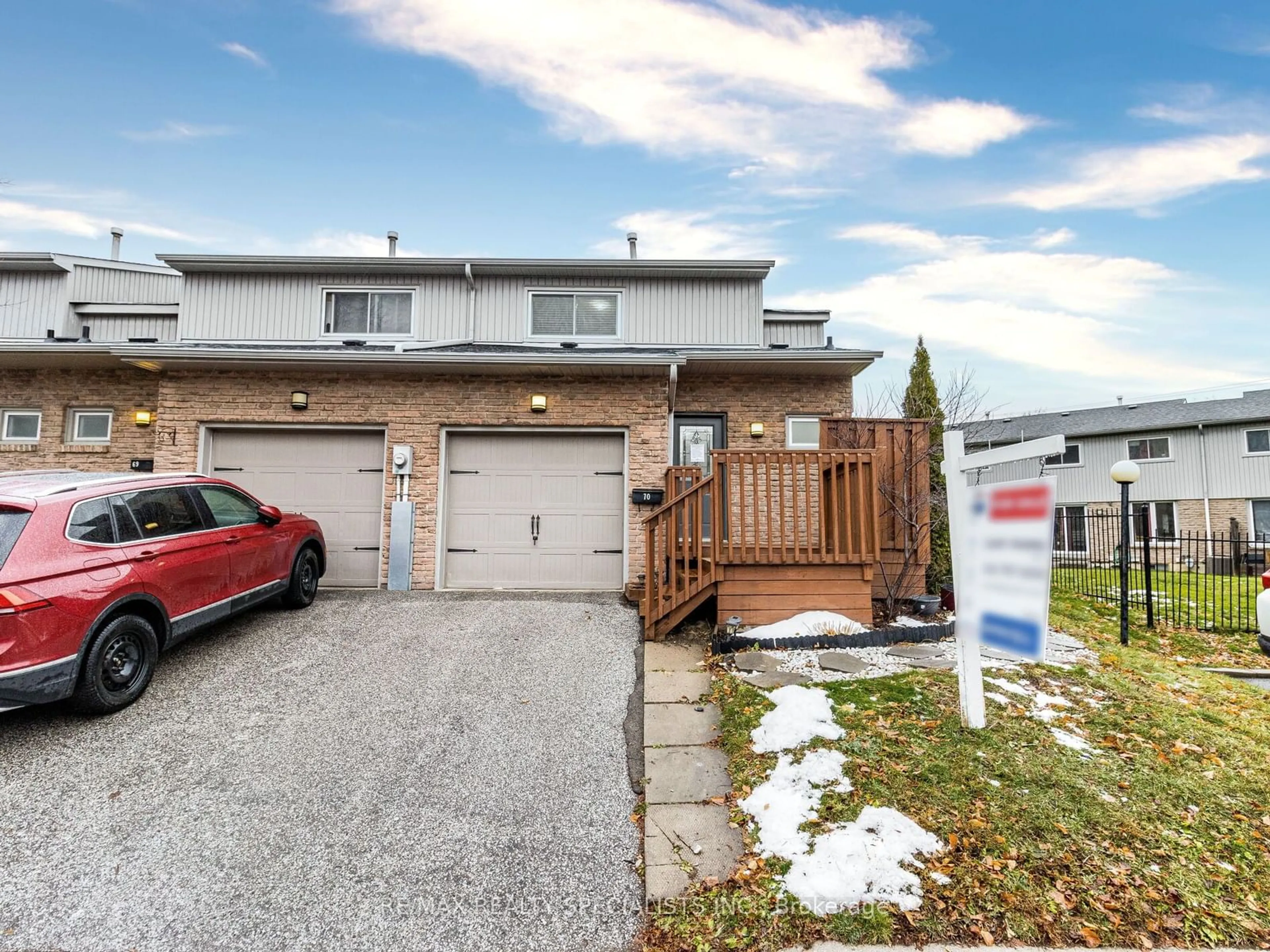 A pic from exterior of the house or condo, the fenced backyard for 399 Vodden St #70, Brampton Ontario L6V 3V1