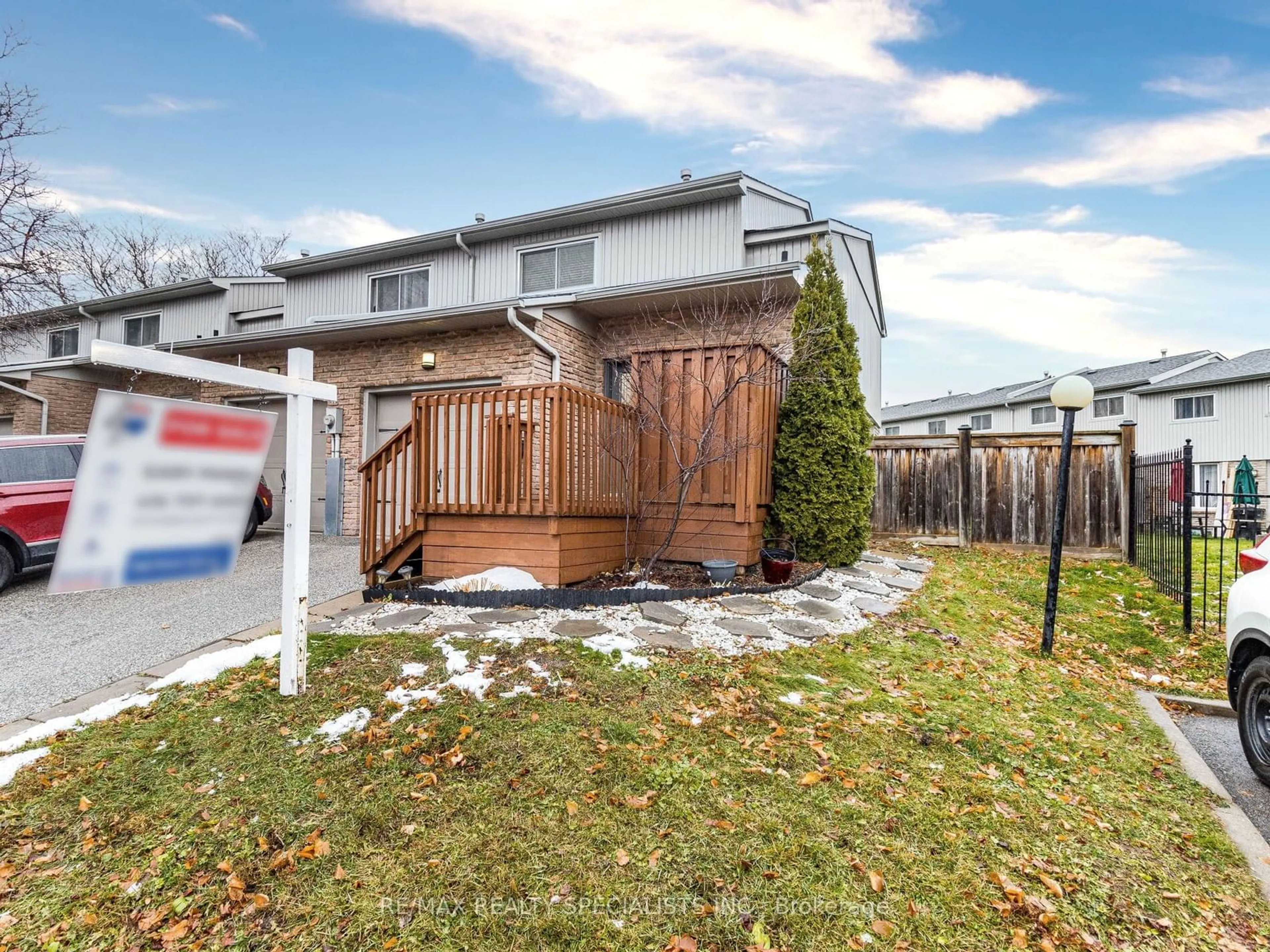 Frontside or backside of a home, the fenced backyard for 399 Vodden St #70, Brampton Ontario L6V 3V1