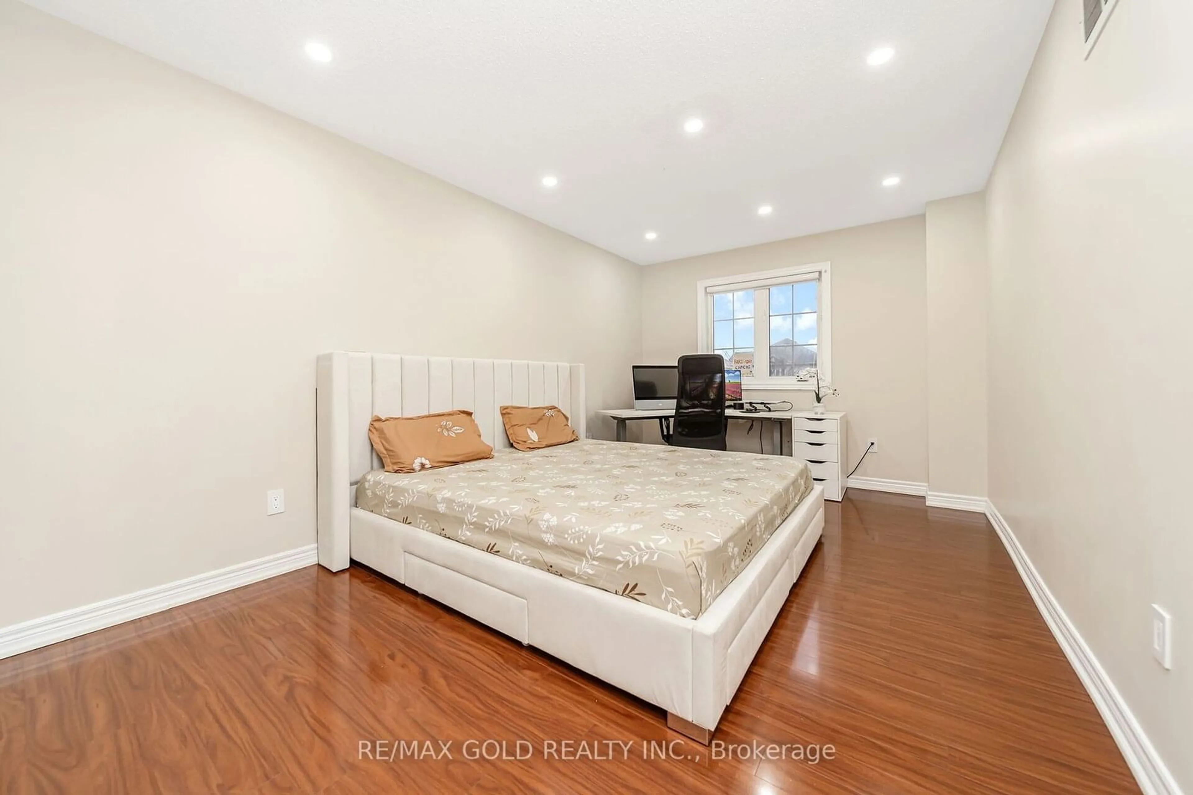 Bedroom with bed, wood/laminate floor for 27 Ridgemore Cres, Brampton Ontario L7A 2L6