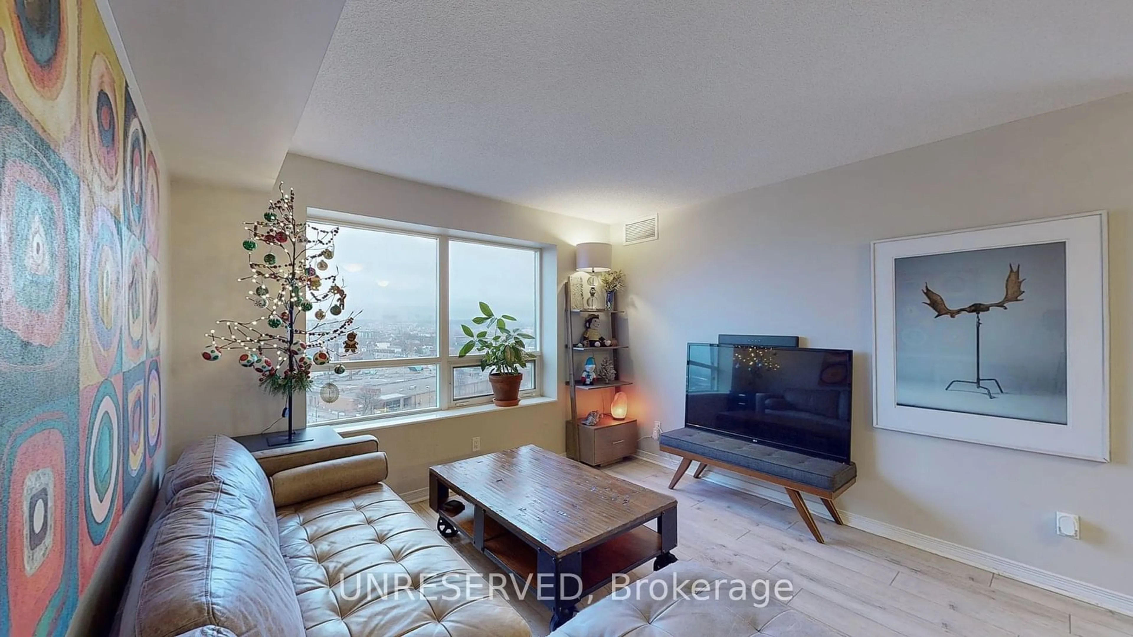 Living room with furniture, wood/laminate floor for 61 Heintzman St #1412, Toronto Ontario M6P 5A2