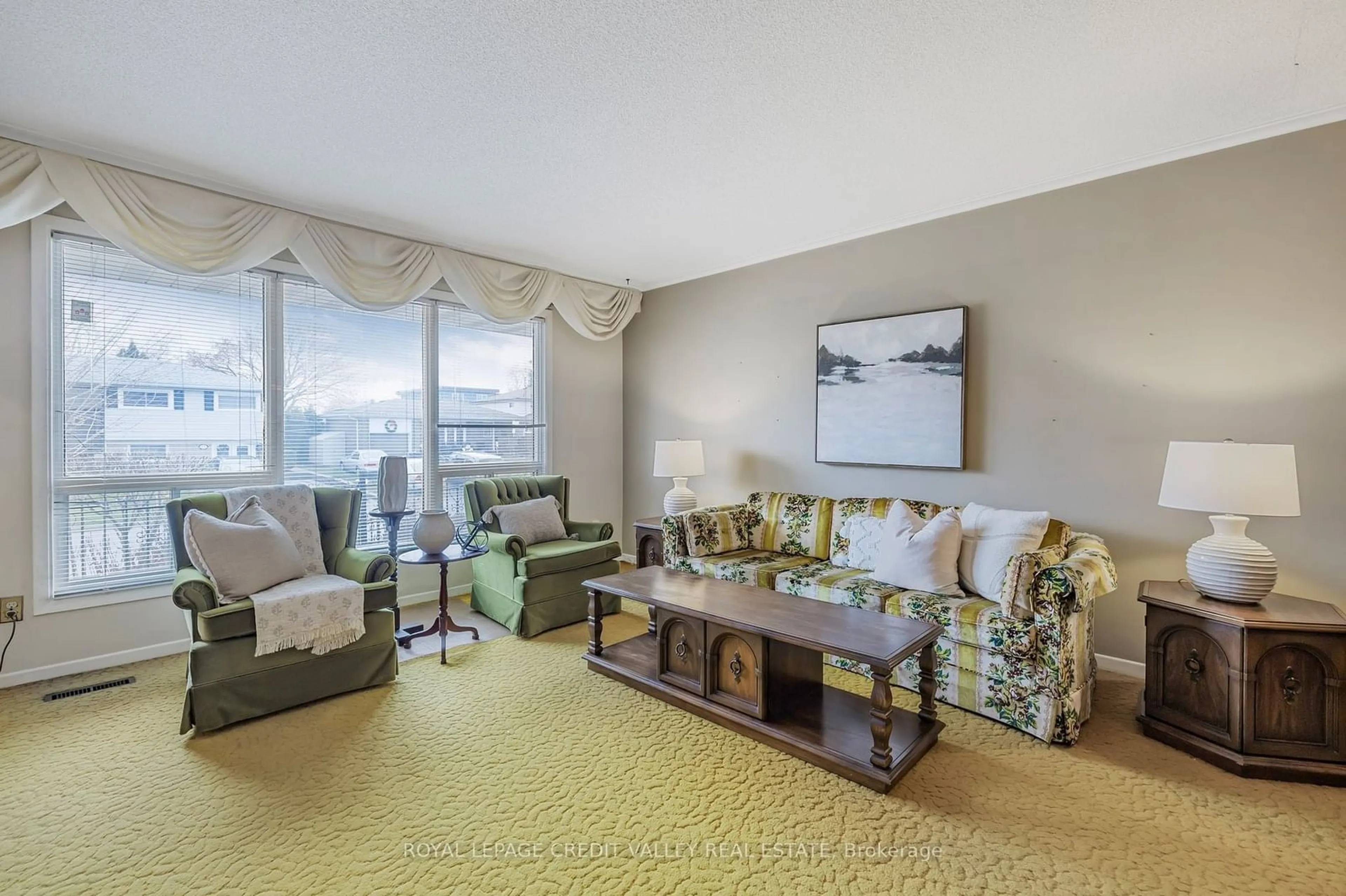 Living room with furniture, carpet floor for 82 Terra Cotta Cres, Brampton Ontario L6W 1C1