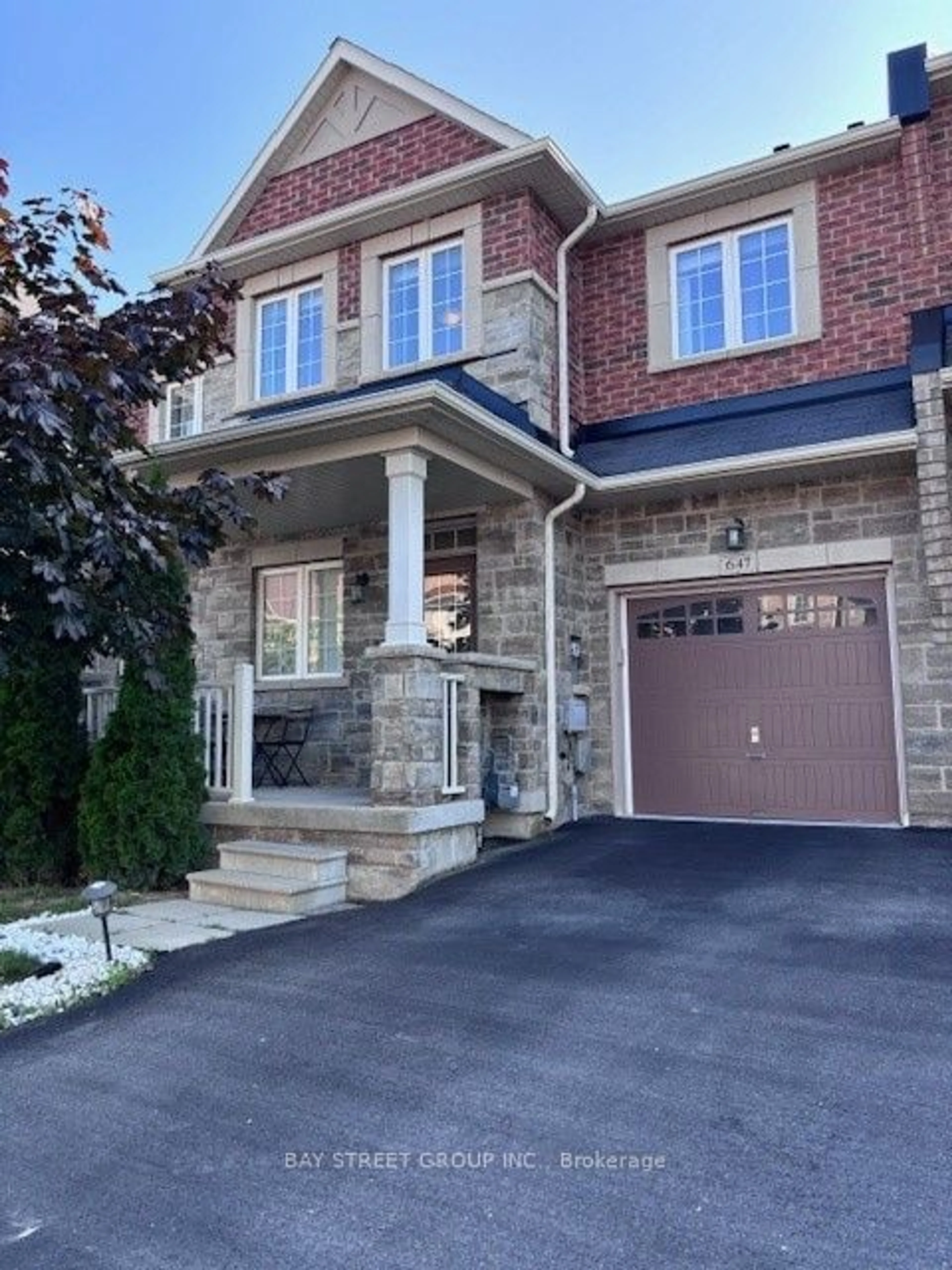 Home with brick exterior material, street for 647 Murray Meadows Pl, Milton Ontario L9T 8L7