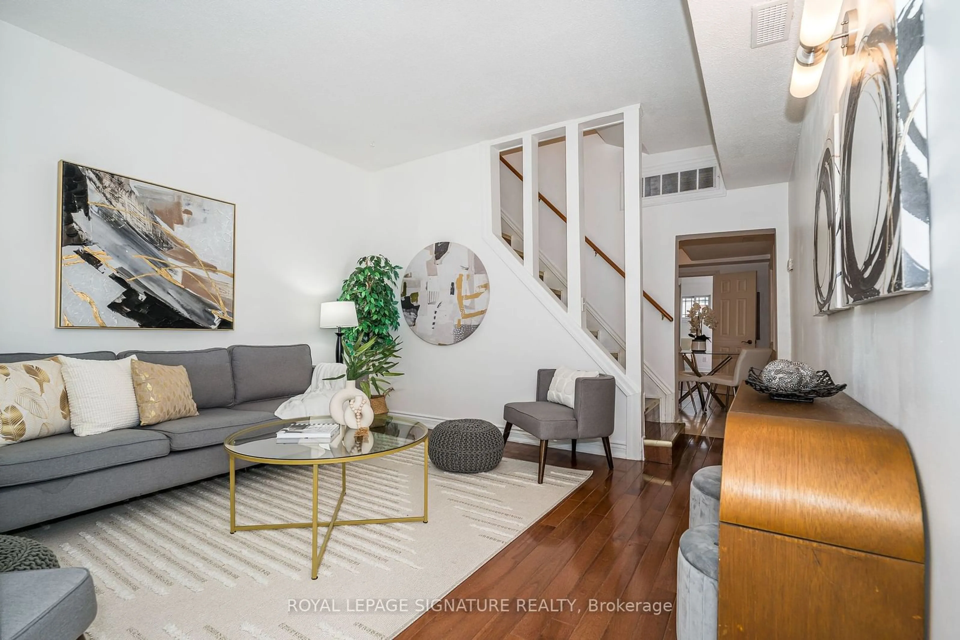 Living room with furniture, wood/laminate floor for 181 Earlscourt Ave, Toronto Ontario M6E 2B2