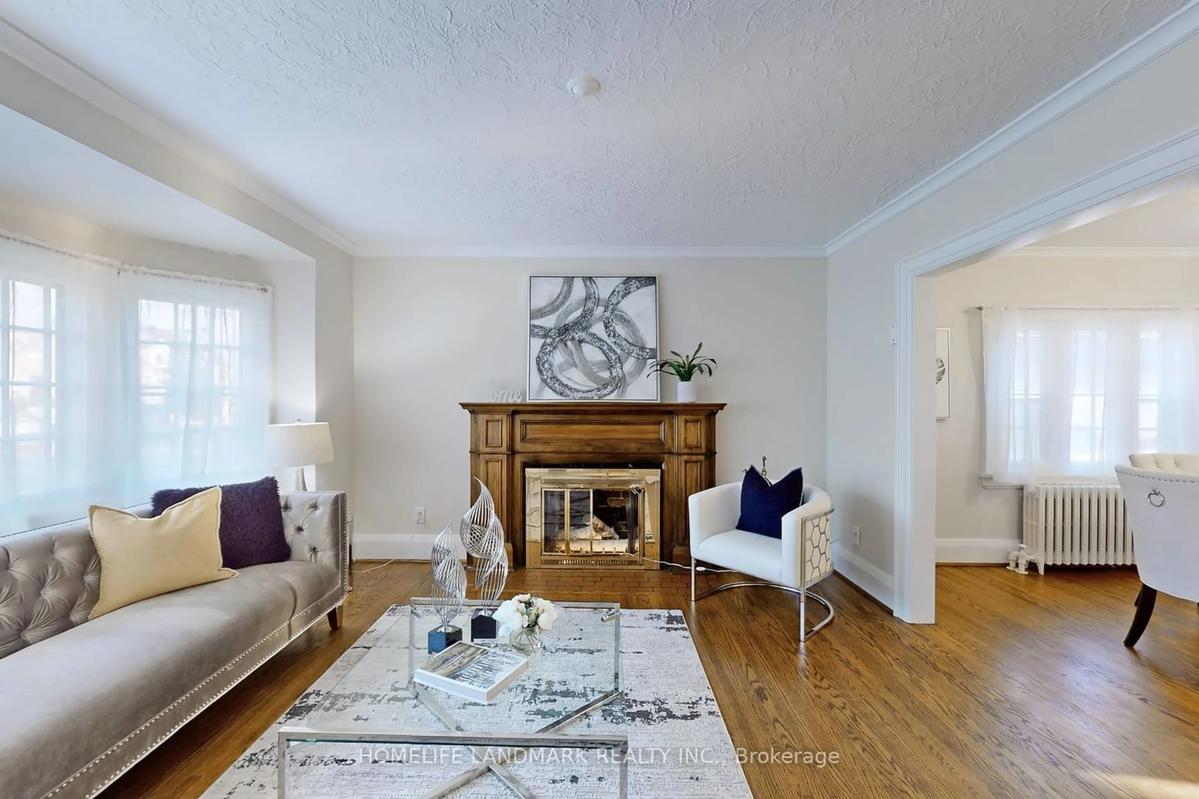 Living room with furniture, wood/laminate floor for 7 Mattice Rd, Toronto Ontario M9A 1E1