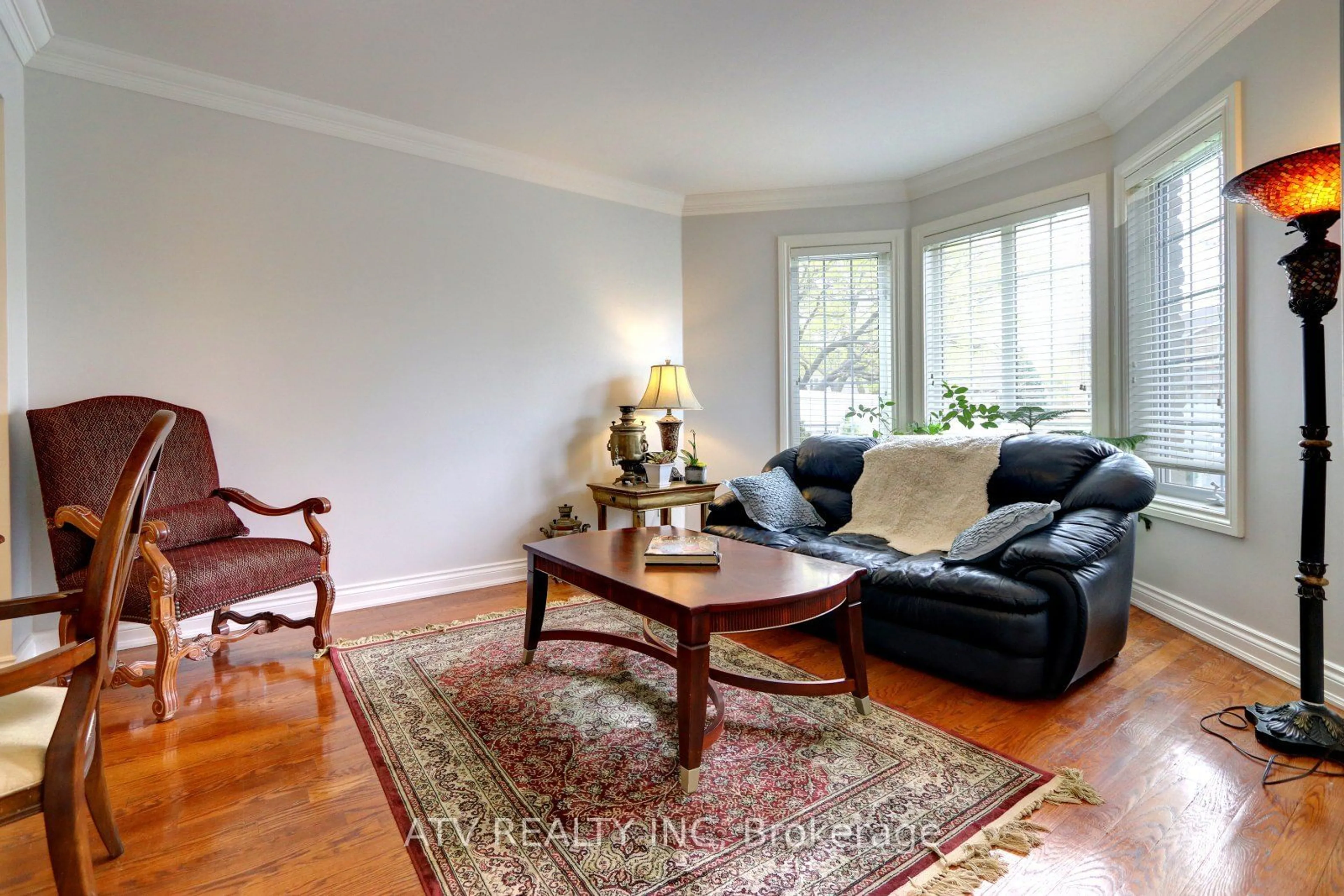 Living room with furniture, wood/laminate floor for 31 Shaver Ave, Toronto Ontario M9B 3T2