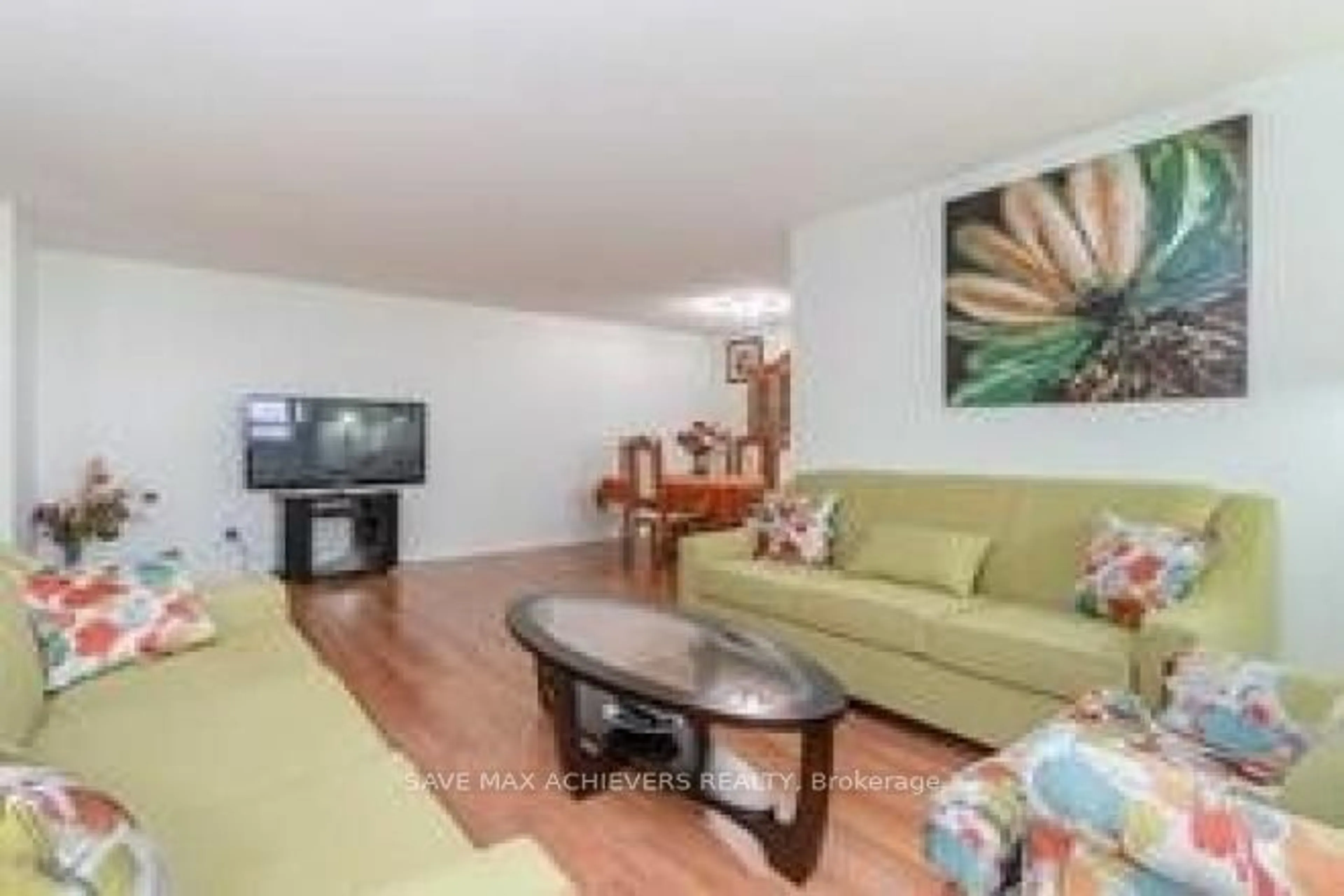 Living room with furniture, wood/laminate floor for 10 Malta Ave #806, Brampton Ontario L6Y 4G6