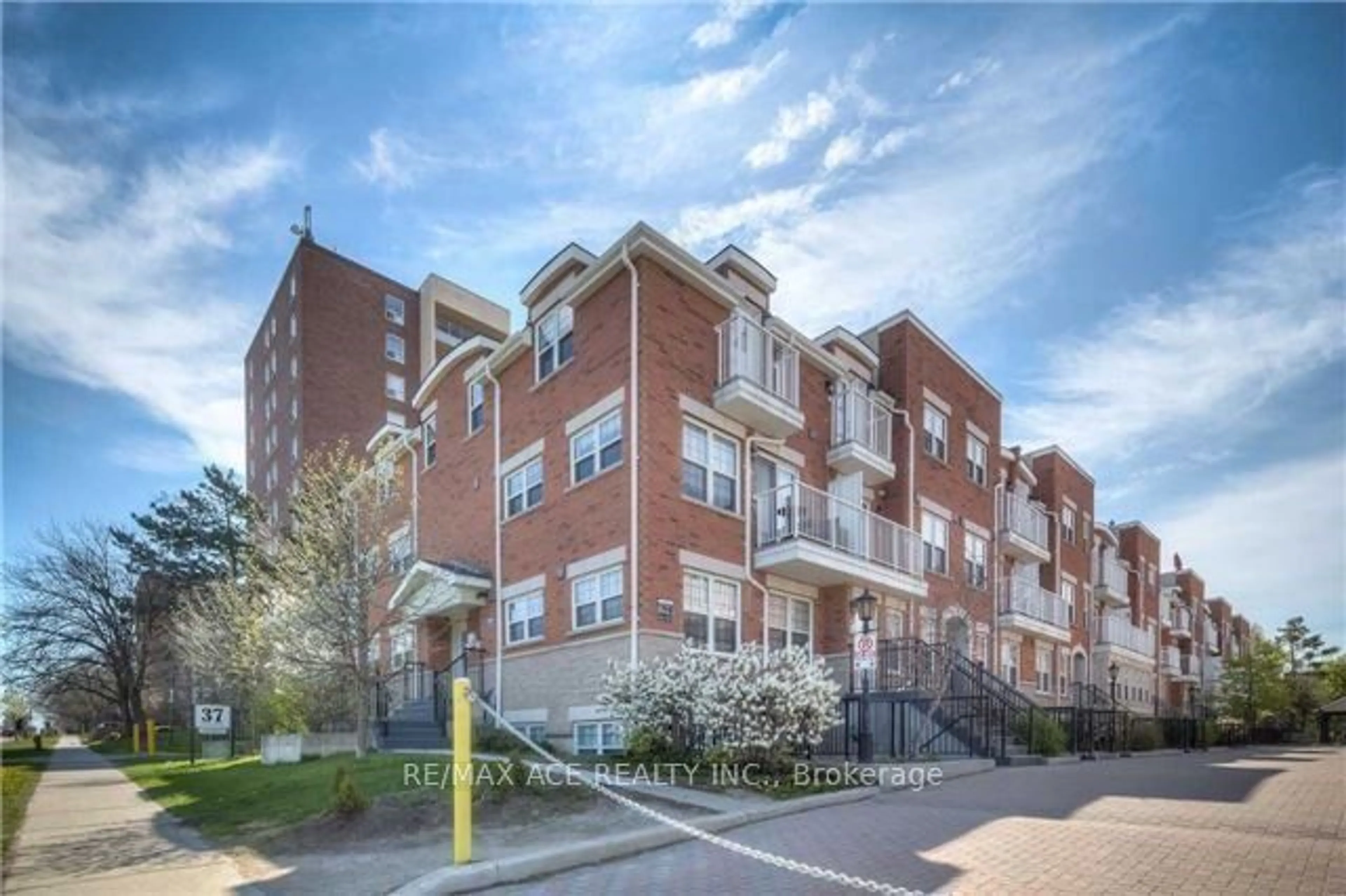 Home with brick exterior material, street for 37 Four Winds Dr #24, Toronto Ontario M3J 1K7